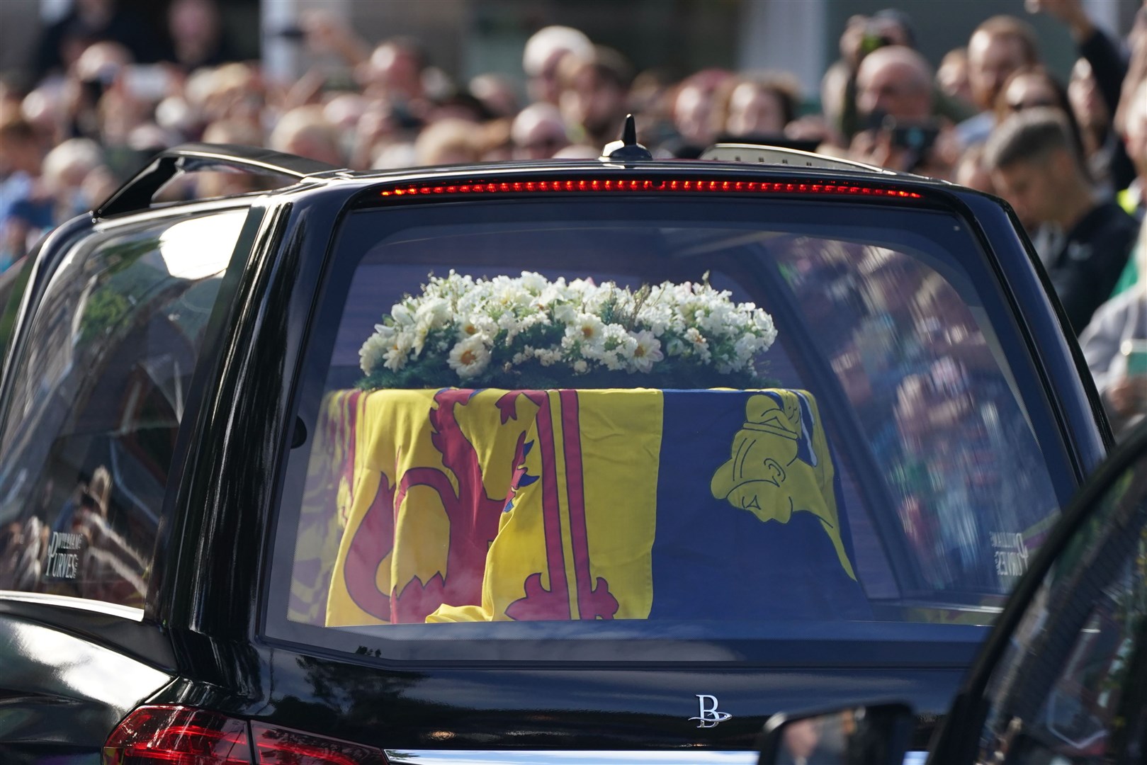 The hearse carrying the coffin of Queen Elizabeth II, draped with the Royal Standard of Scotland (Andrew Milligan/PA)