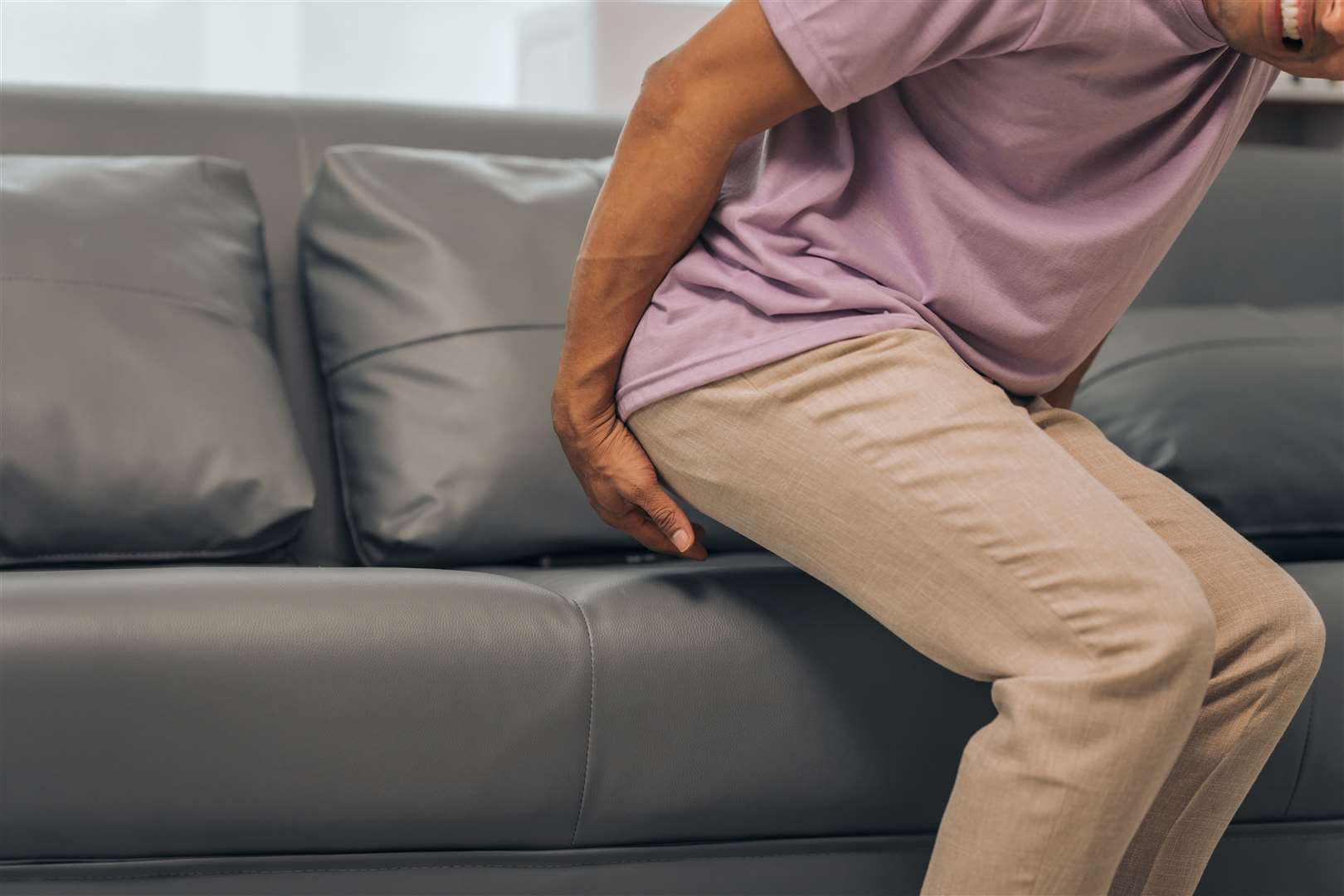 Even sitting on a sofa can cause some people pain.