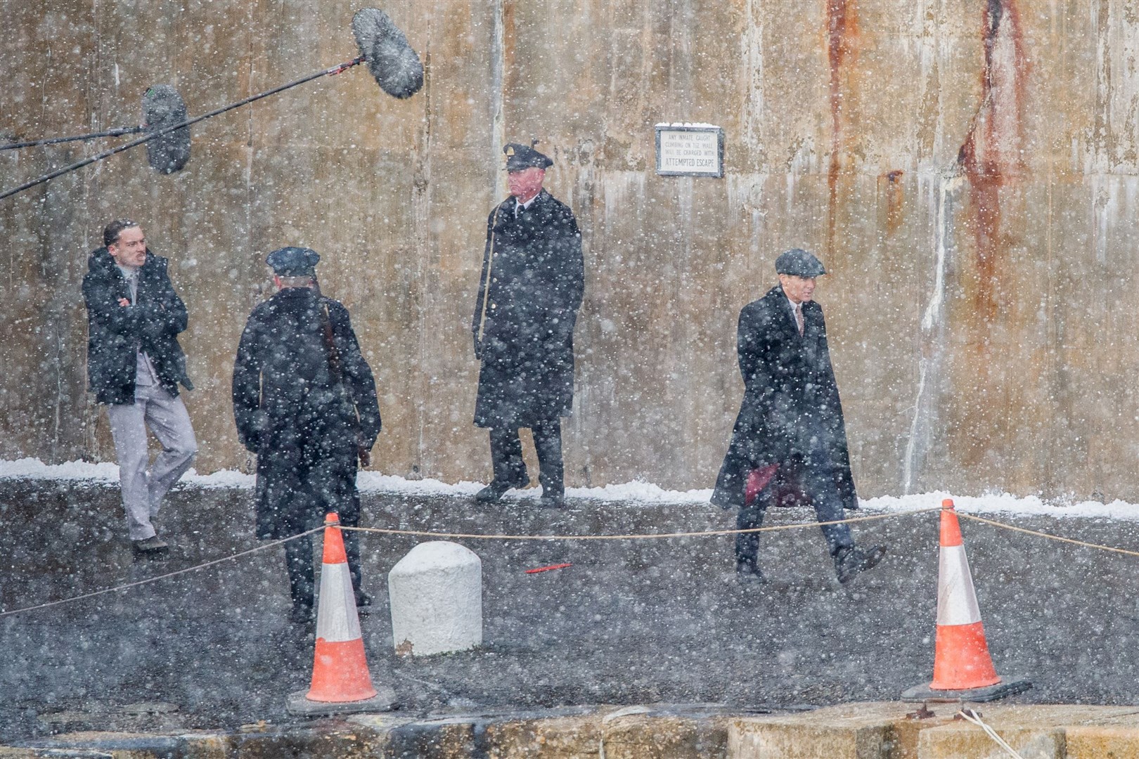 Finn Cole and Cillian Murphy film during a snow storm at Portsoy harbour. Picture: Daniel Forsyth