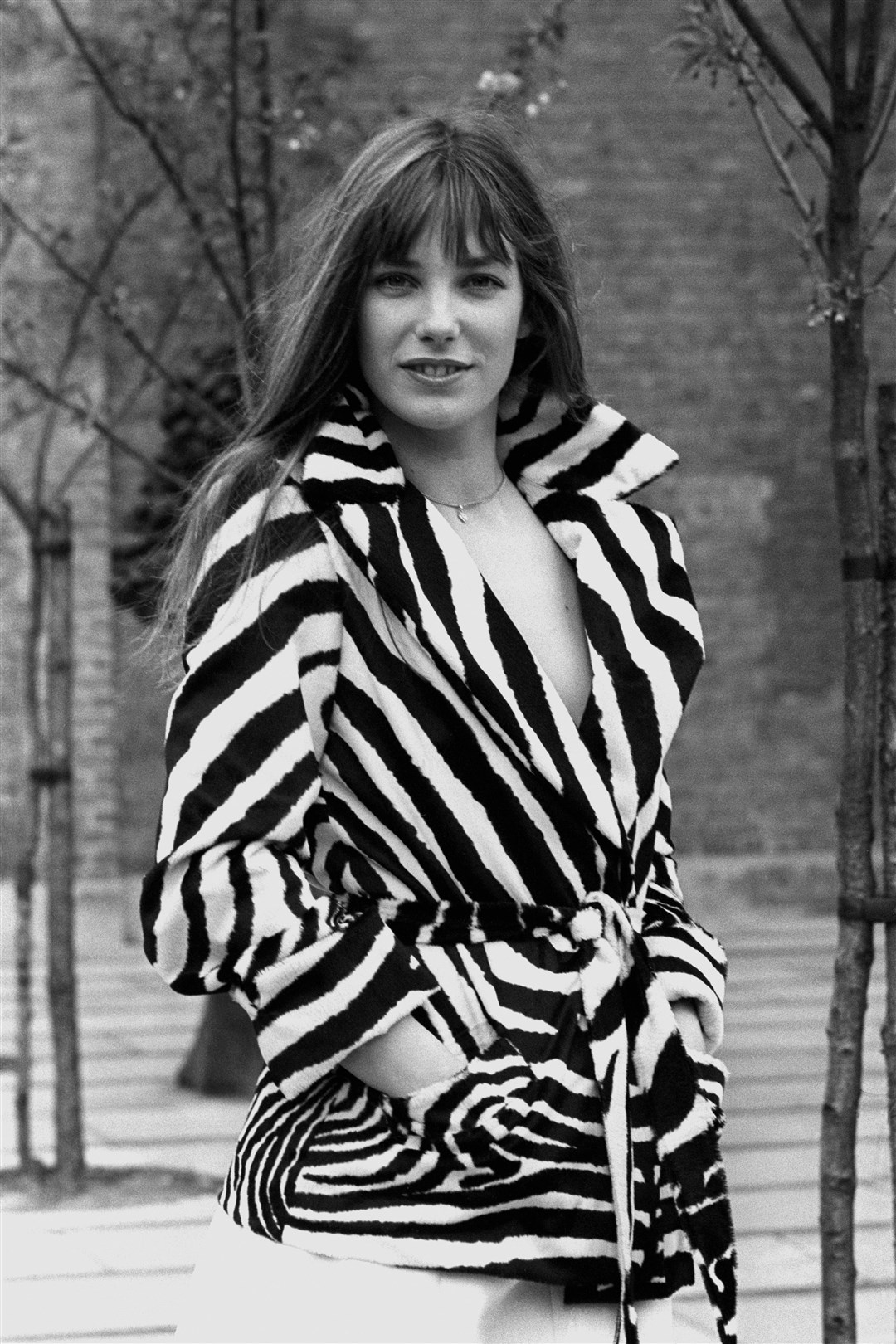 A tie-belted zebra print jacket in fake fur shown in London by Jane Birkin in 1973 (PA)