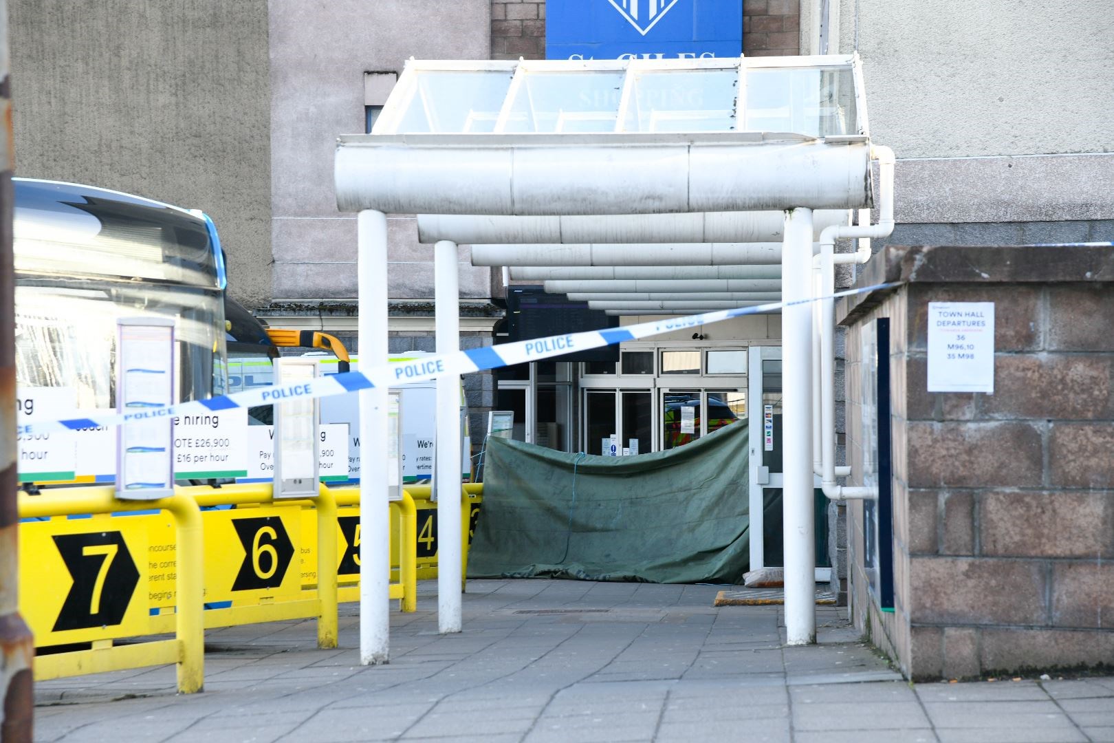 An area near the entrance to the St Giles Centre is covered up as forensics inspect the scene. Picture: Beth Taylor
