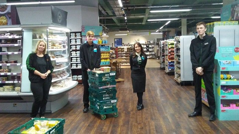 Staff members at Elgin Marks & Spencer with a food donation.