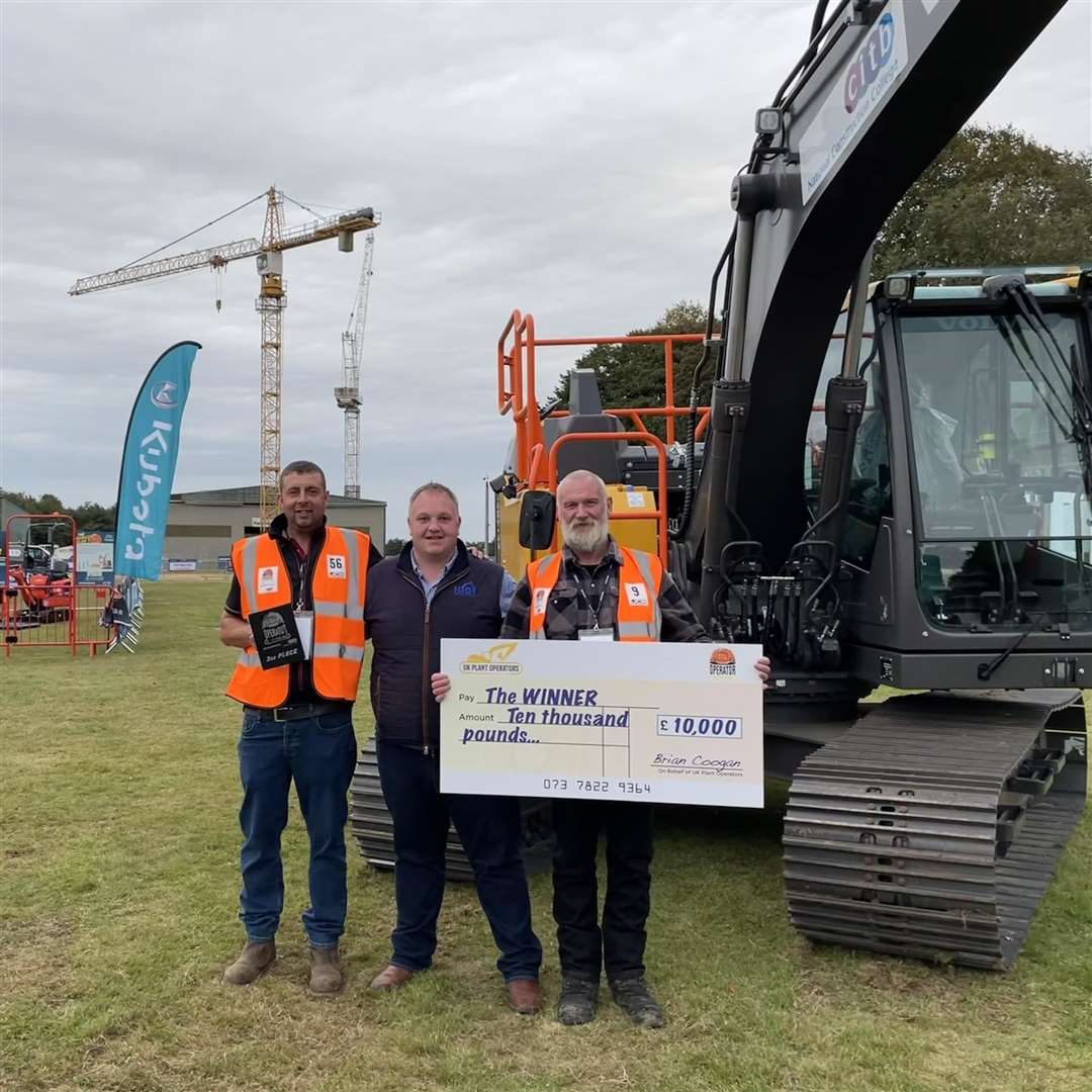 Gordon Durno shows off his £10,000 winner's cheque, joined by immediate past president of the Scottish Plant Operators Association Callum Mackintosh (left) and third placed William Frame.