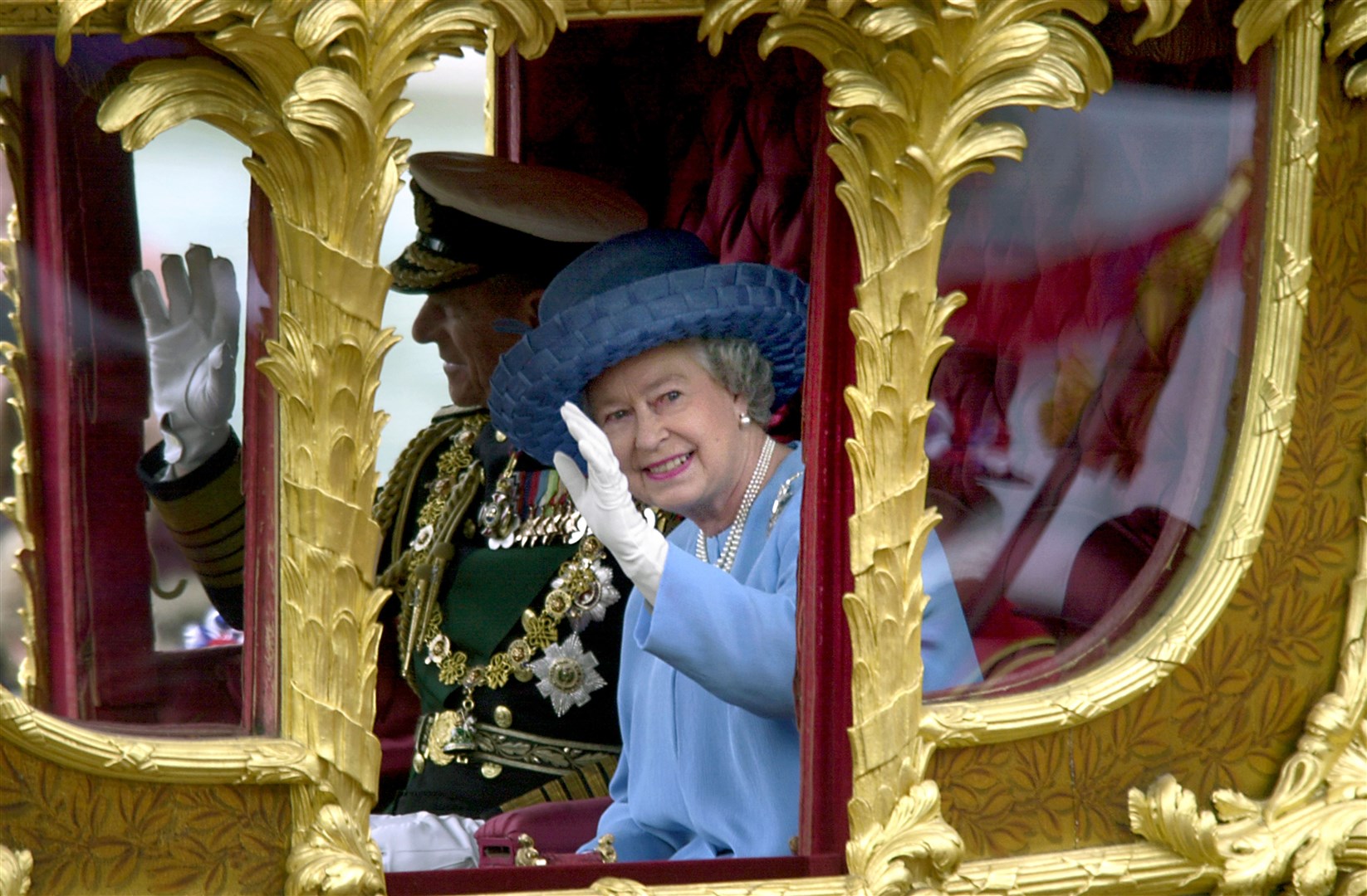The Queen riding in the Gold State Coach from Buckingham Palace to St Paul’s Cathedral in 2002 (PA)