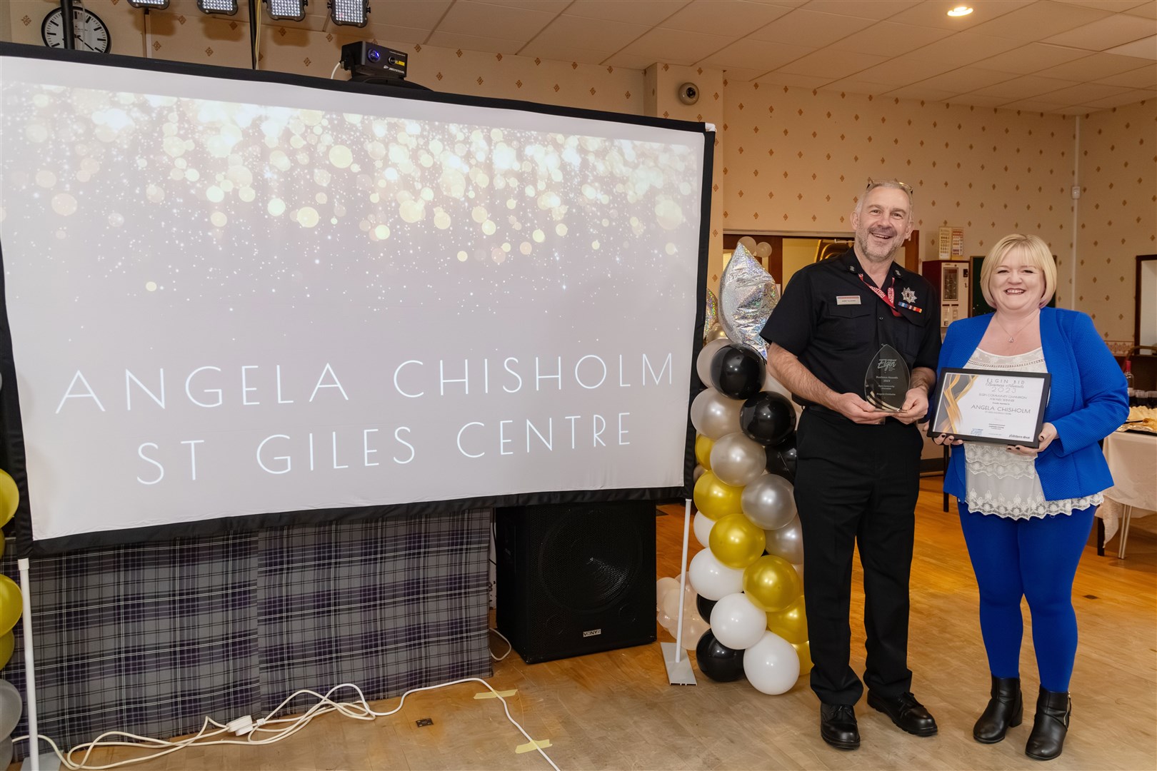 Andy Illston presenting the Elgin Community Champion Award to Angela Chisholm. Picture: Beth Taylor.