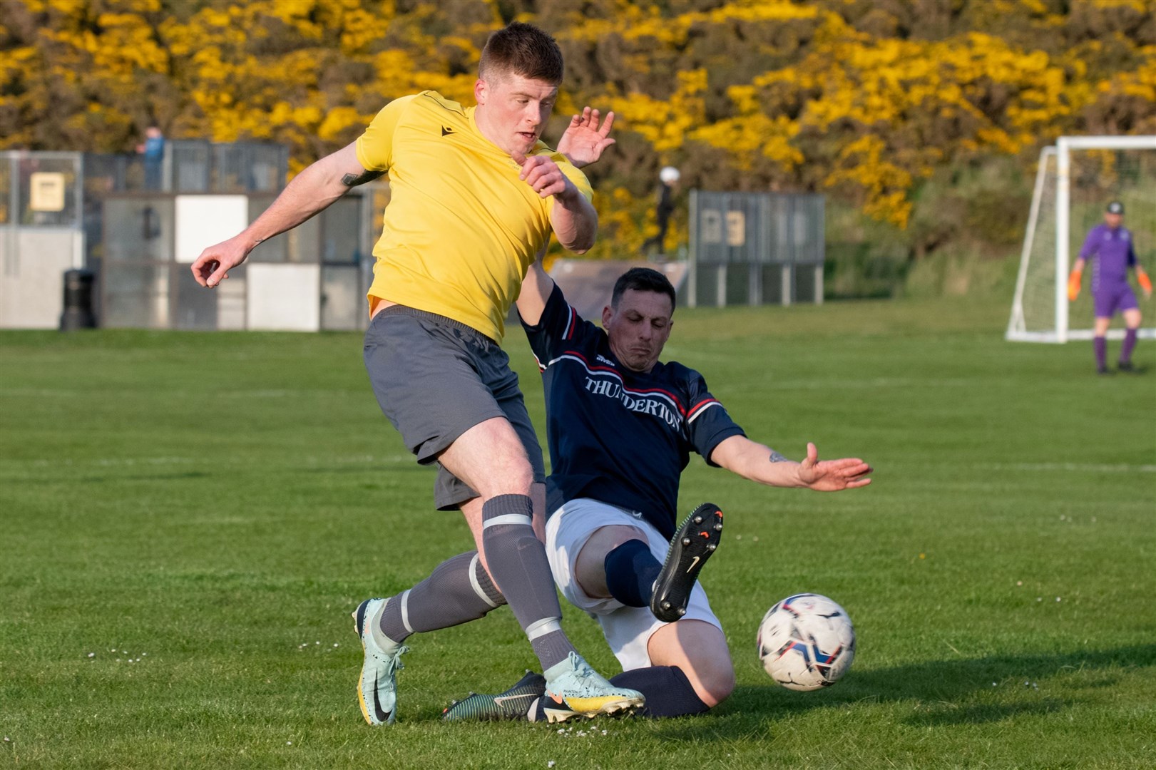 Hopeman's Matt Herley is tracked by Thunderton's Russell Geddes as he plays up the wingHopeman FC vs Thunderton FC - Moray Welfare League 2024. Picture: Daniel Forsyth.