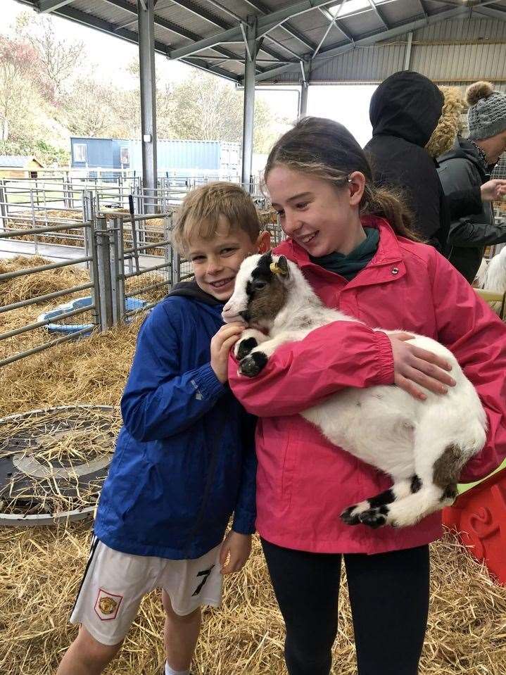 Ailsa and Fergus Milne with one of the goats at the farm.