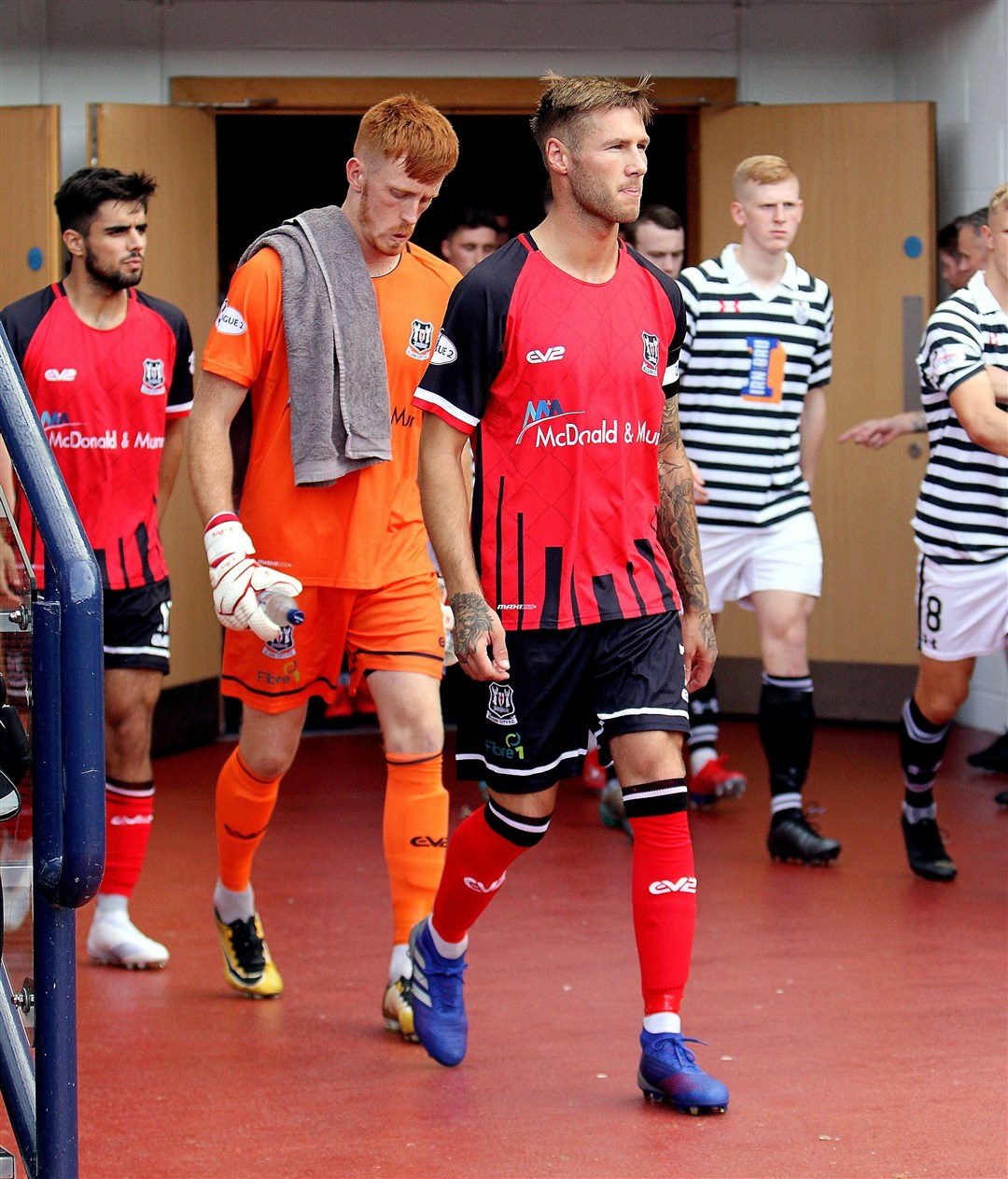 Brian Cameron leads out Elgin at Hampden. Pictures: Bob Crombie