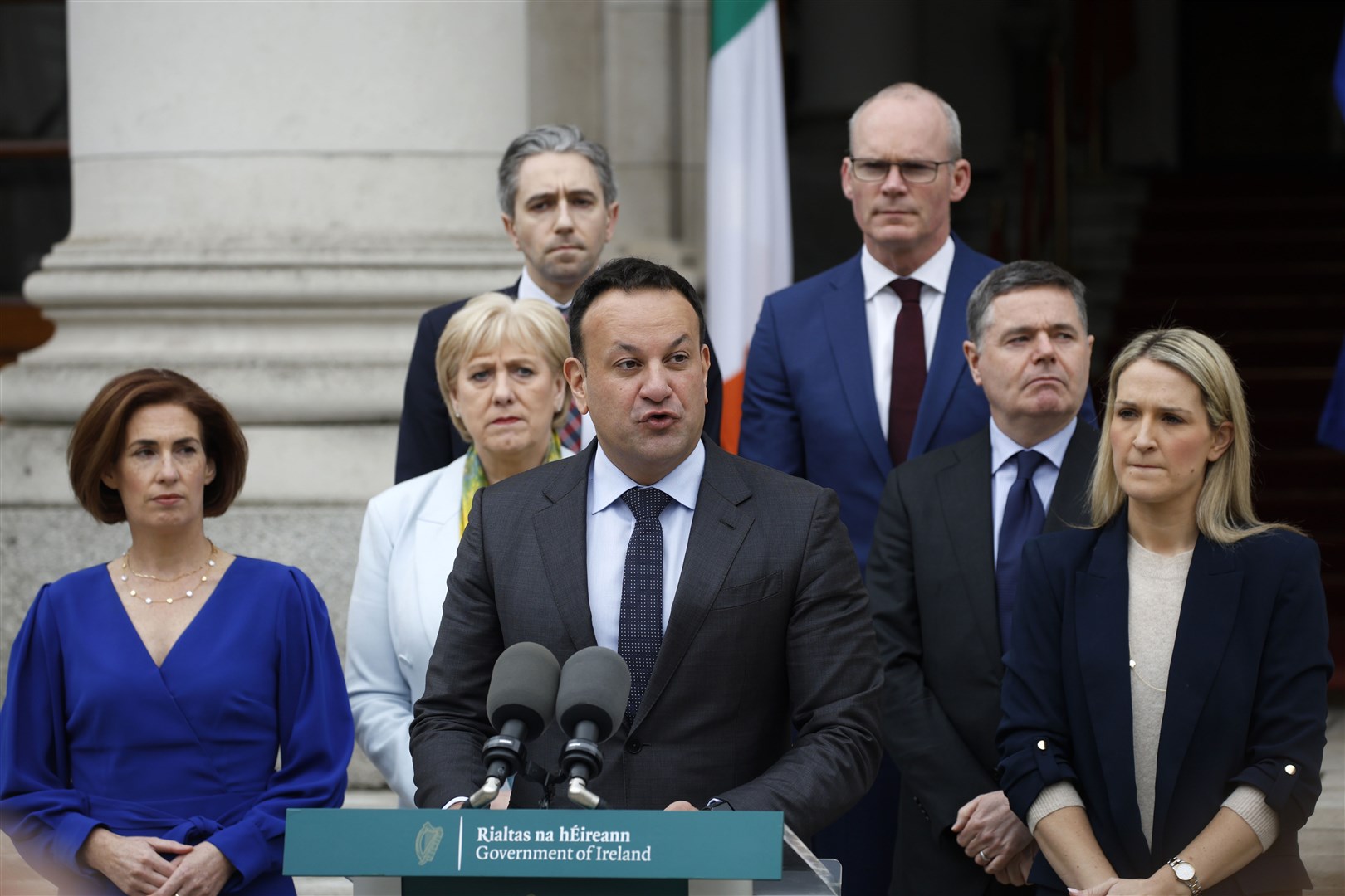 Leo Varadkar flanked by supporters speaking to the media at Government Buildings in Dublin (Nick Bradshaw/PA)