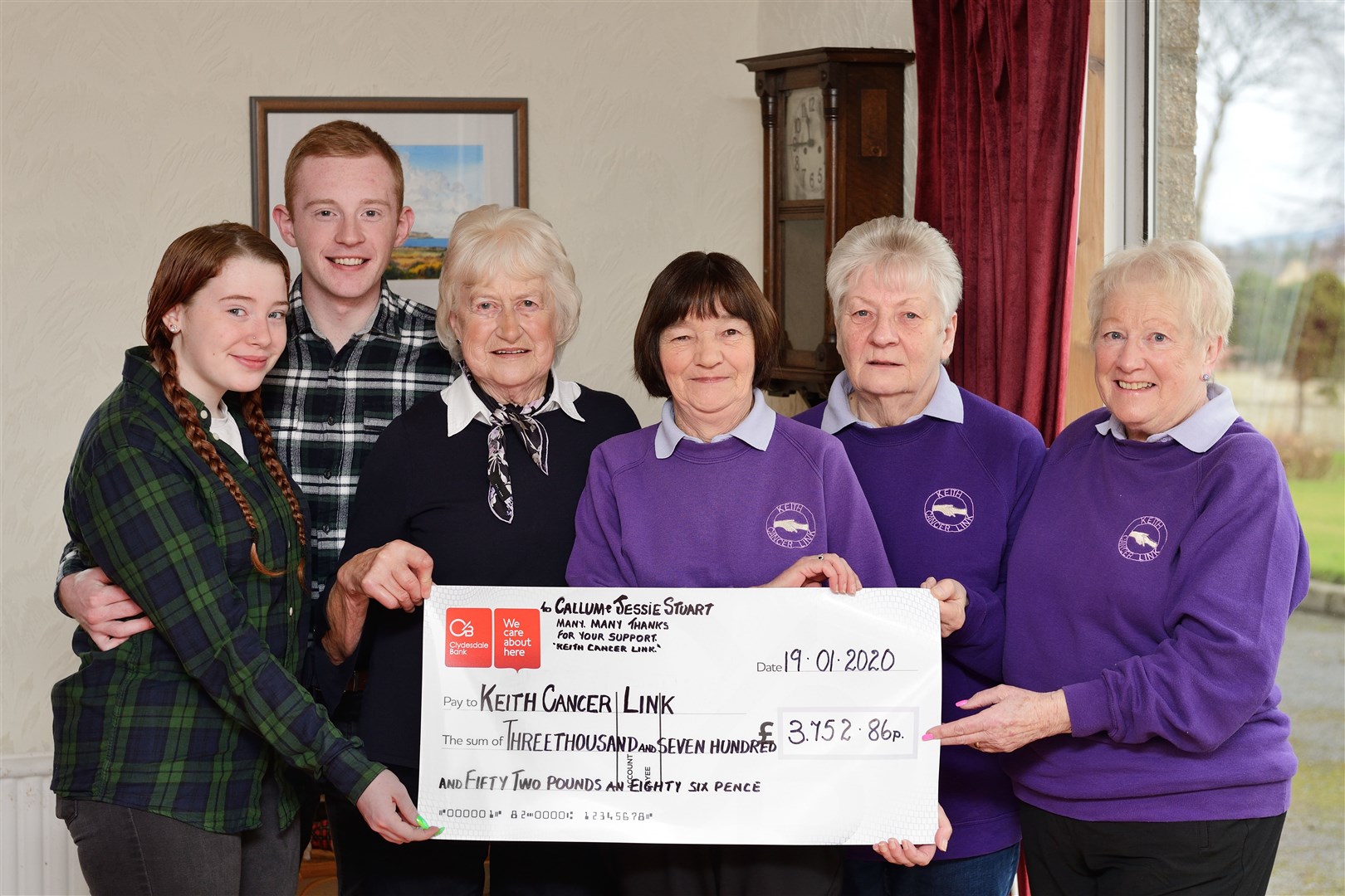 Keith man Callum Stuart and (from left) girlfriend Kayleigh Dalgarno and granny Jessie Stuart present a cheque for £3752 to Keith Cancer Link's Isobel Sadowski, Irene Martin and Adeline Reid. Picture: John MacLeod/Moraylight.