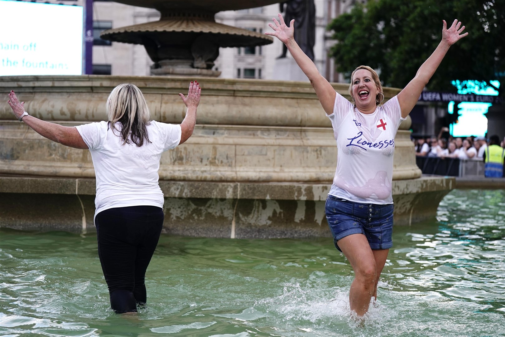 Fans celebrate the final whistle in Trafalgar Square, London (Aaron Chown/PA) 
