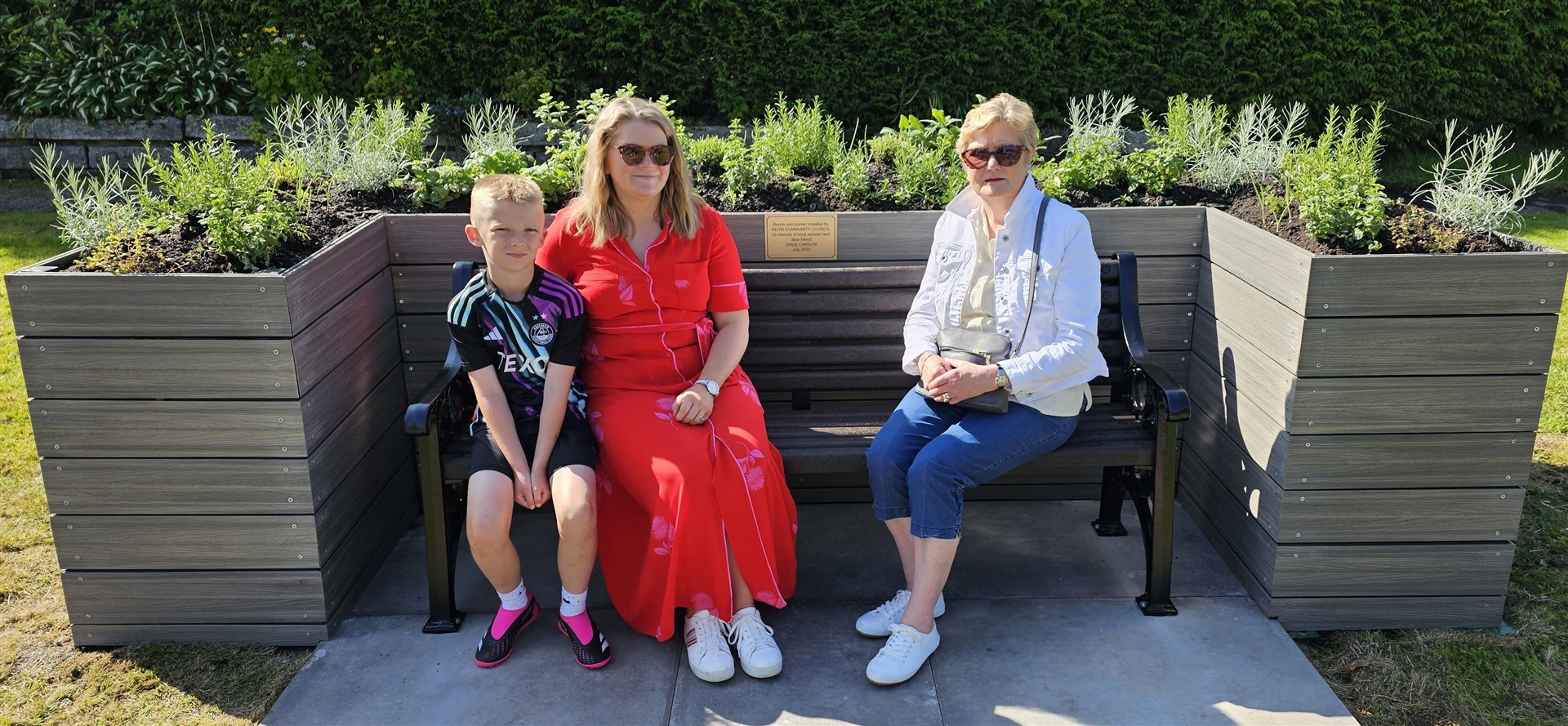 Harry, Denice and Helen sat on the bench.