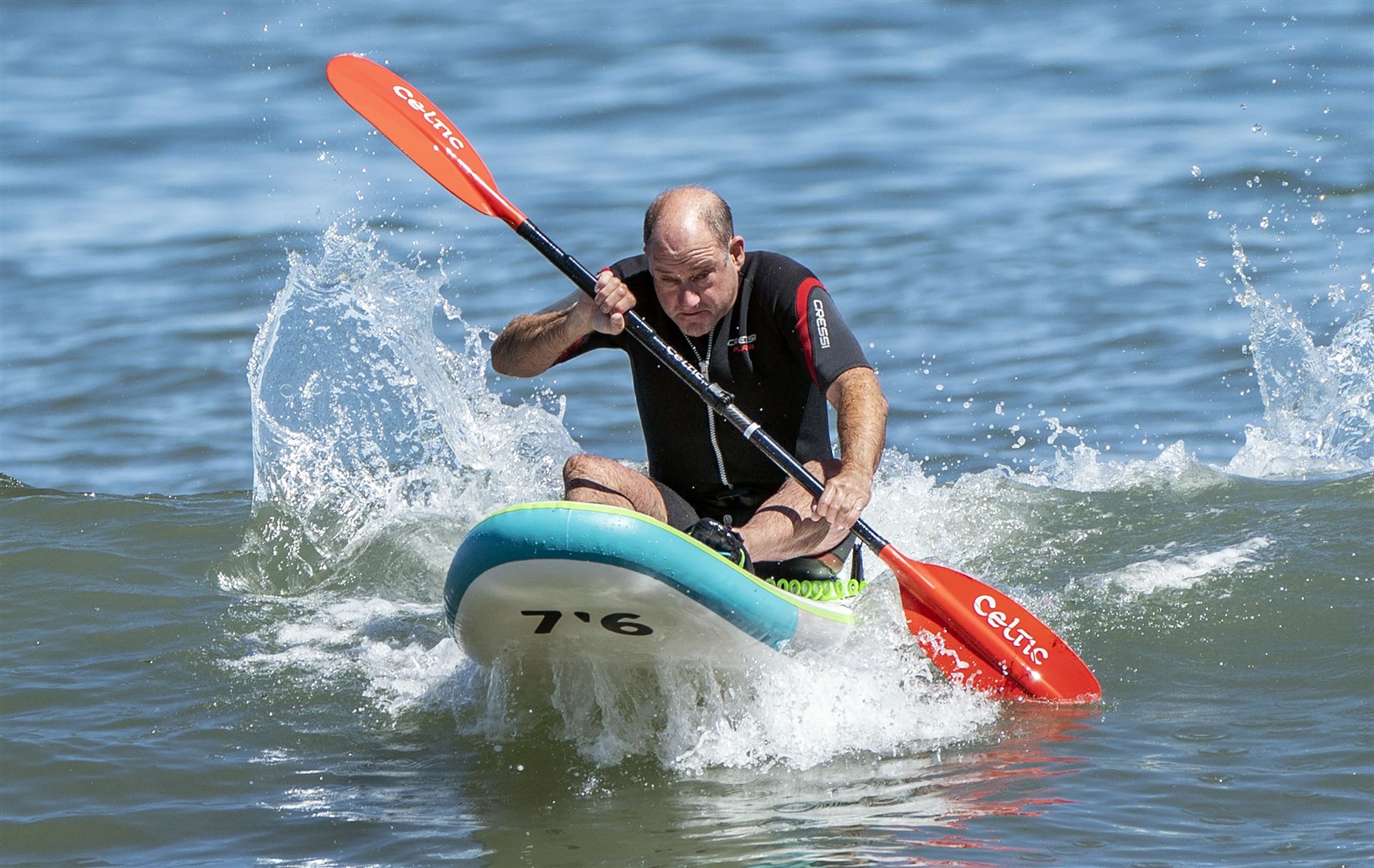 A man paddles away in Scarborough (Danny Lawson/PA)