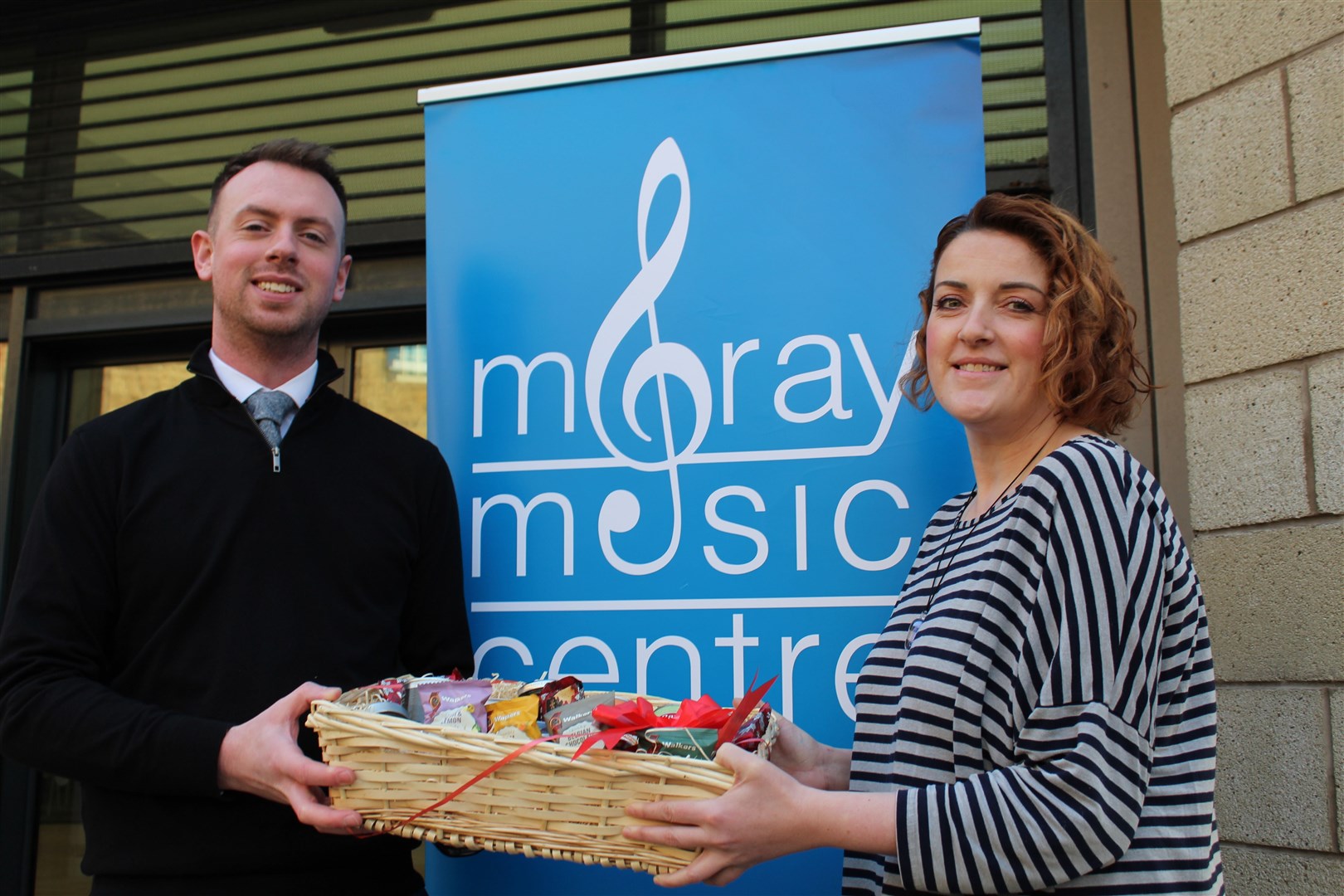 Acting head of Moray Council’s music instruction service Alexander Davidson with Moray Food Plus volunteer development officer Gillian Pirie