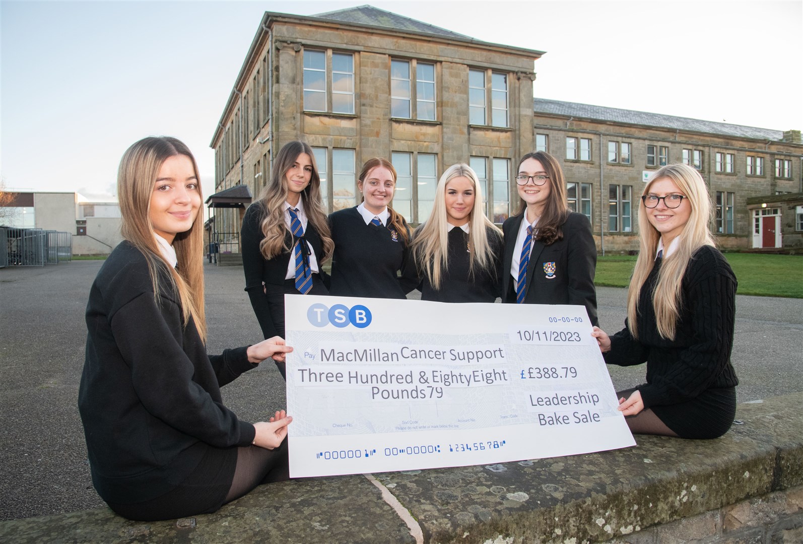 Showing off the fruit of their baking labours in the form of a cheque to Macmillan Cancer Support are (from left) Makenna Gauld, Eden Wojcik, Layla Calder, Natasha Gillies, Abbie Phimister and Phoebe Goodall. Picture: Daniel Forsyth