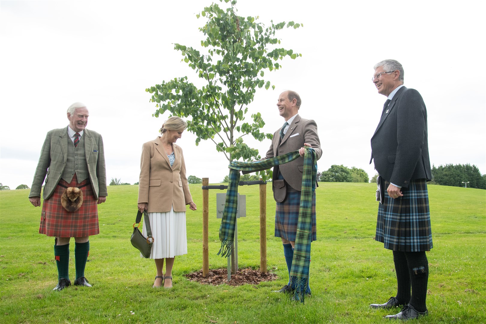 The Earl and Countess of Wessex and Forfar unveil a plaque for the Queen's Green Canopy in Elgin's Cooper Park as they are joined by Lord Lieutenant of Moray Seymour Monro (left) and Lord Lieutenant of Banffshire Andrew Simpson (right). Picture: Daniel Forsyth