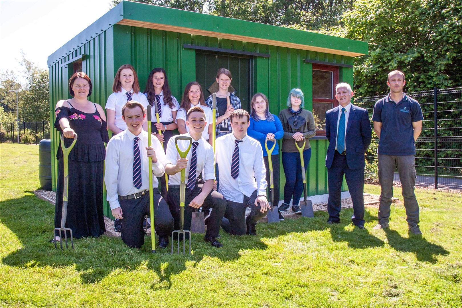 Celebrating the new outdoor classroom are (from left) biology teacher Tracey Shaw alongside Elgin Academy pupils involved in the project and Frank Reid, managing director of Robertson Northern and Andy Horne, site manager at Robertson.