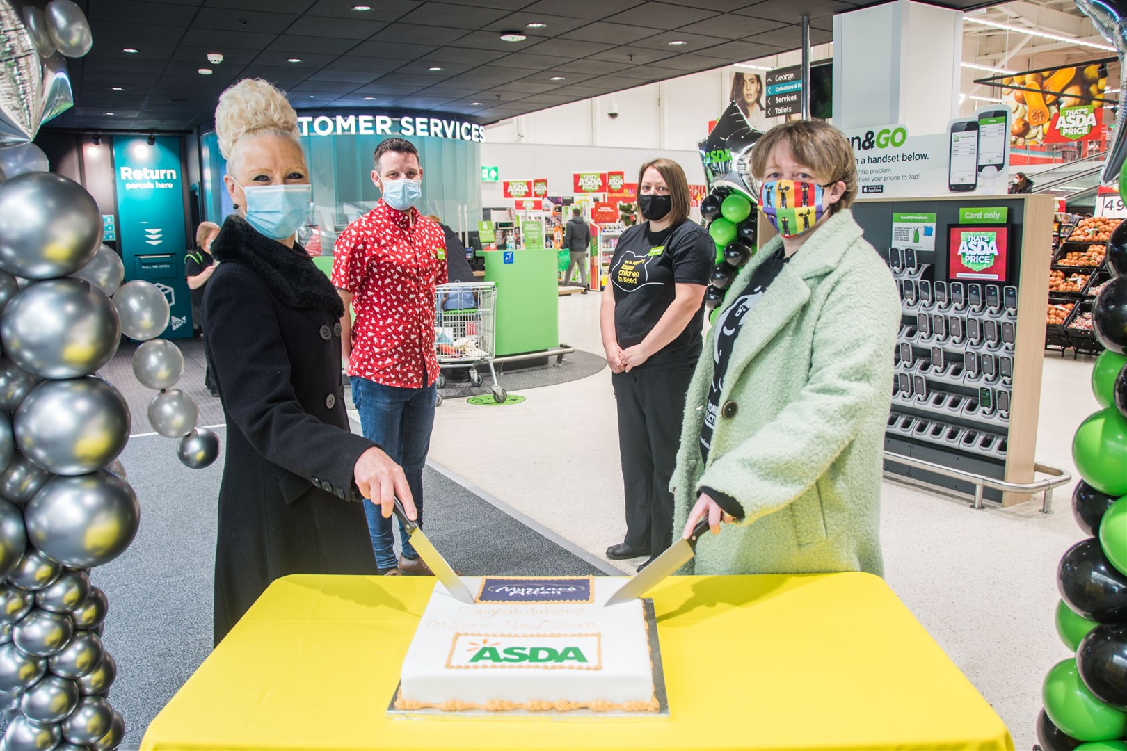 Kathy McGrath-Gunn (L) and Mairi McCallum (R) open the newly refurbished Elgin Asda alongside Store Manager Martin Green and Community Champion Kaye Macleod...Picture: Becky Saunderson..