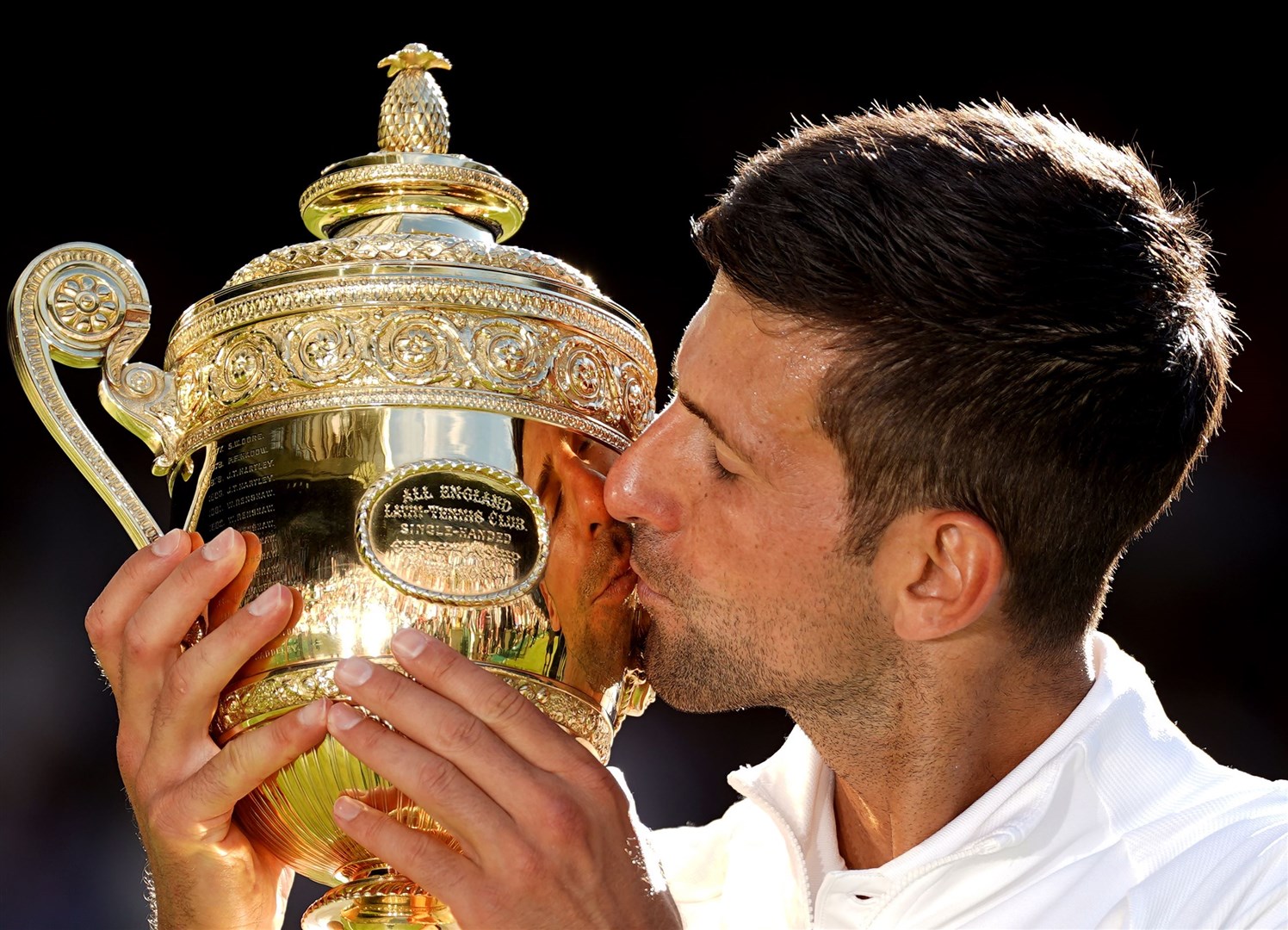 Novak Djokovic celebrates with the trophy (Adam Davy/PA)