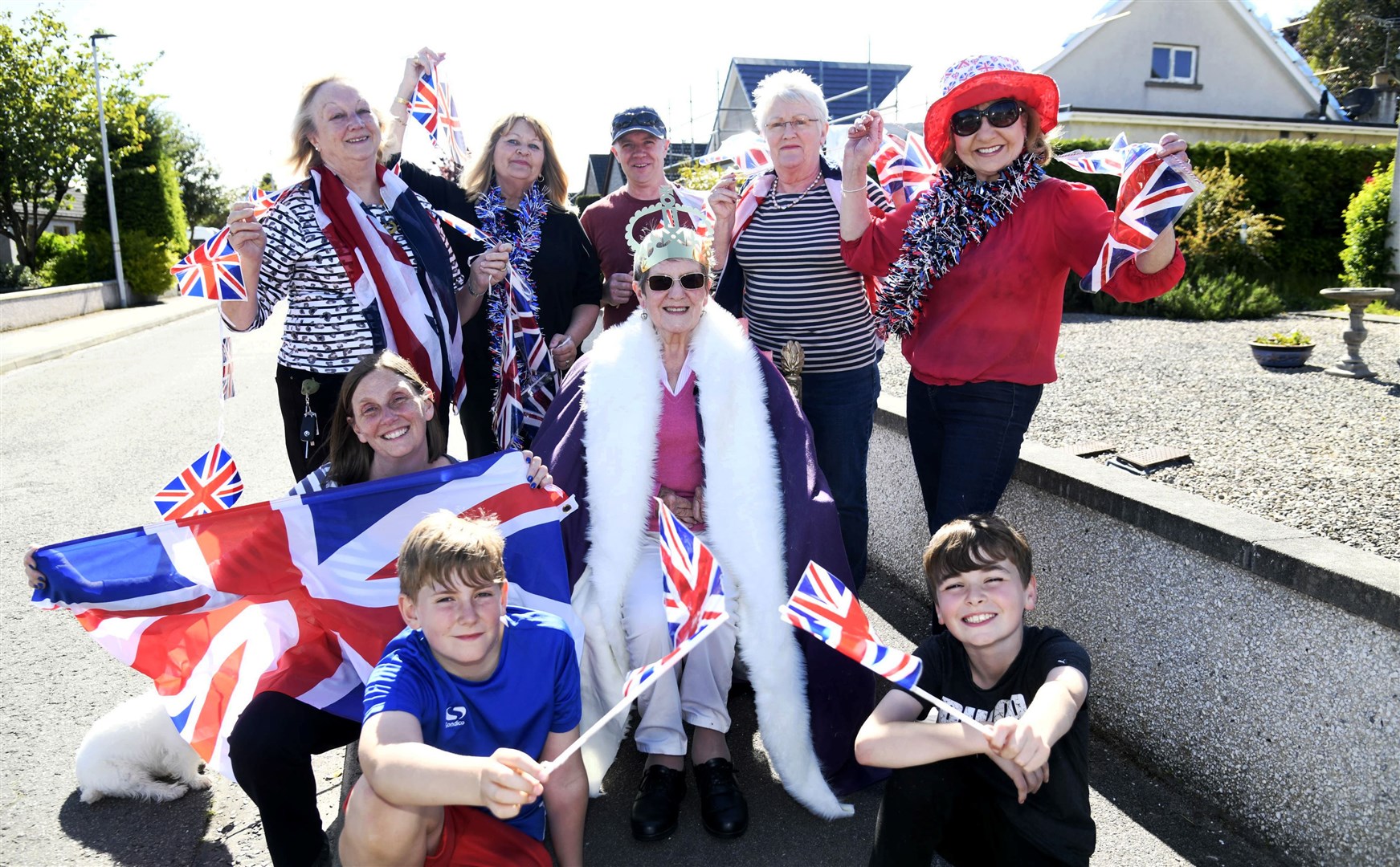 Getting ready for a party. From left, clockwise, Matthew Hanover, Lisa Hanover, Muriel Noble, Norma Watson, Alastair Clarihew, Mieke Lloyd, Louise McLean and Adam McBride, with the Queen for the day Helen McKidd in the middle. Picture: Becky Saunderson