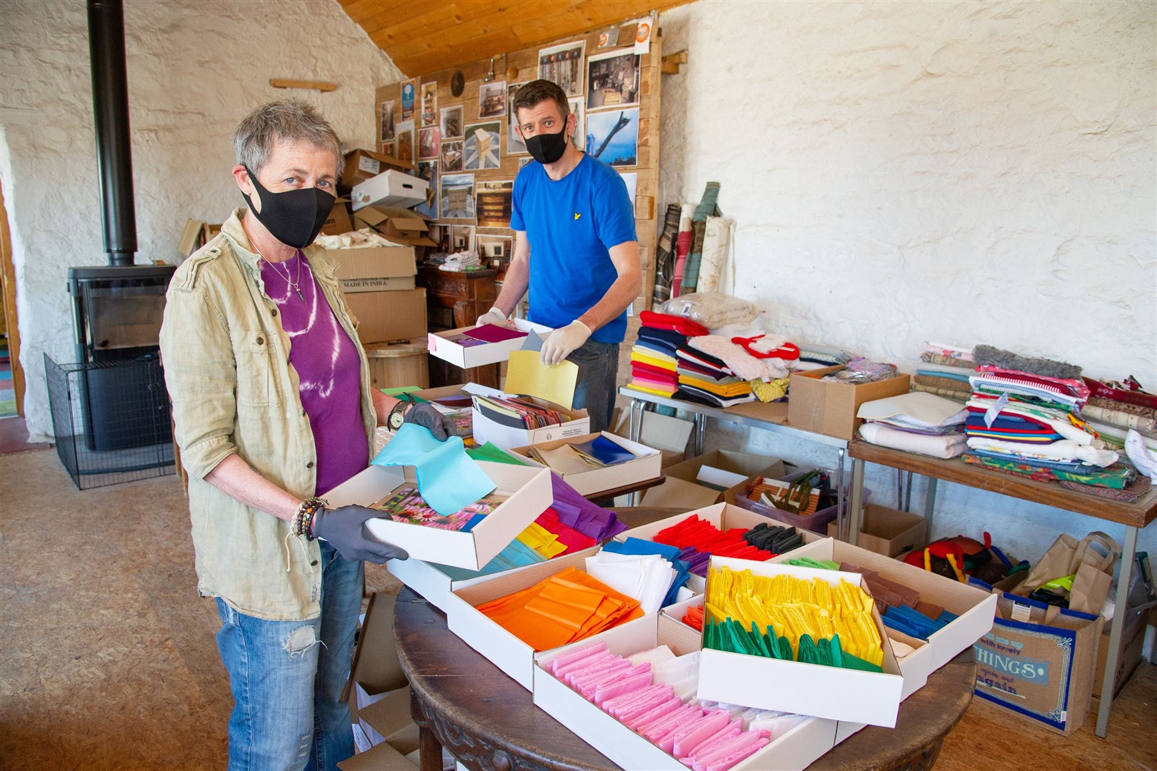 Directors at Mindful Creations CIC Debbie Wright and Chris Andrews assemble art materials into packs destined for some of Moray's most vulnerable. Picture: Daniel Forsyth.