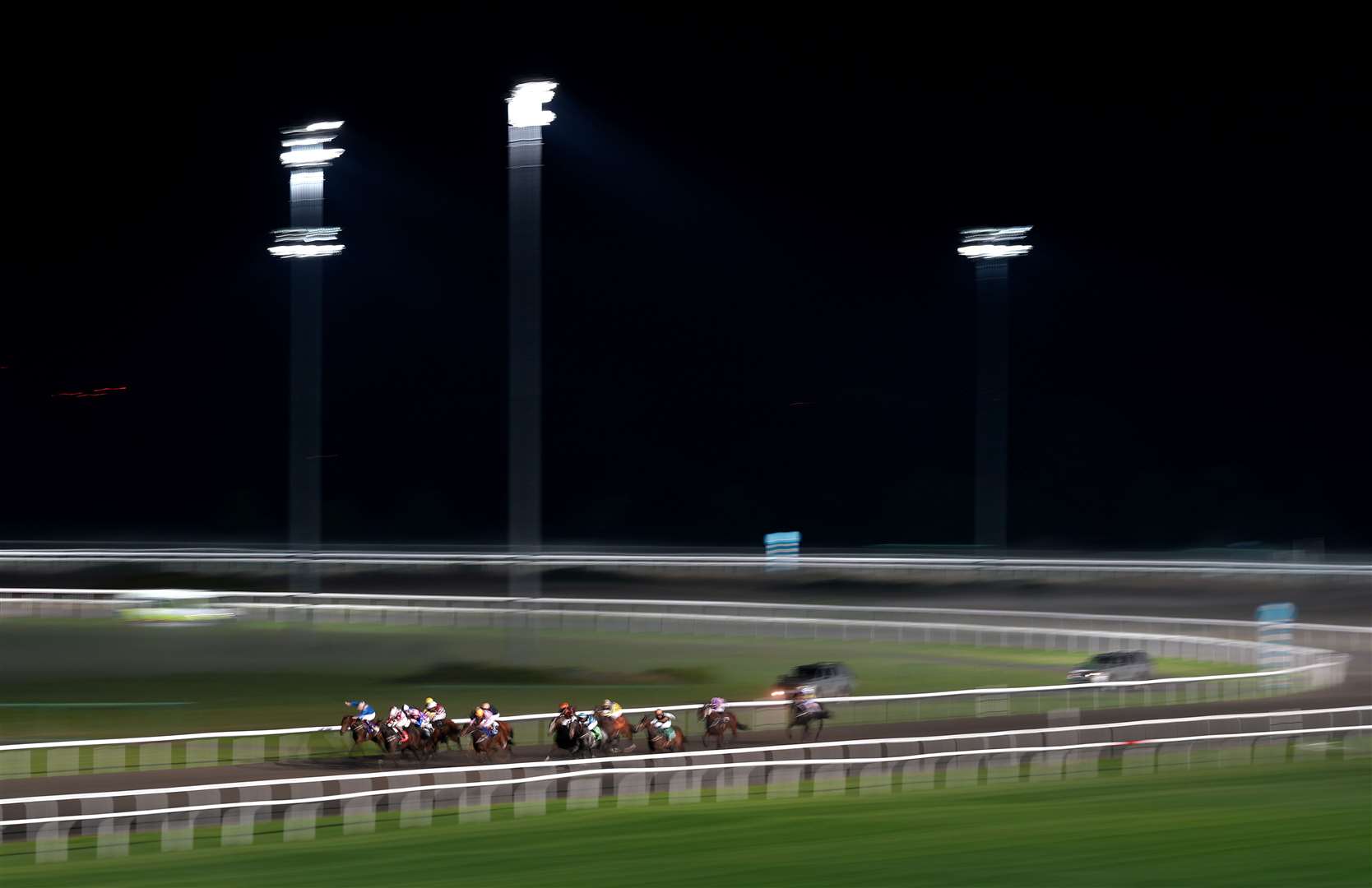 Runners in action on the all-weather at Kempton Park (John Walton/PA)