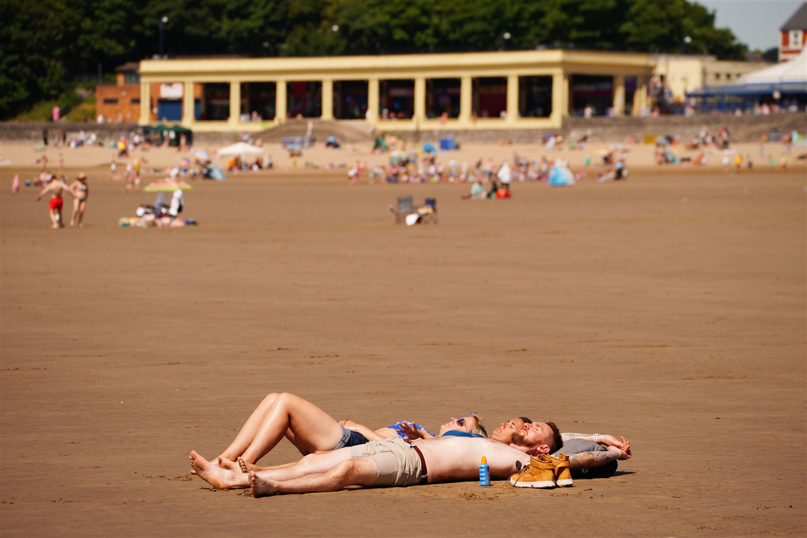 People enjoy the sunshine at Barry Island, Wales (Ben Birchall/PA)