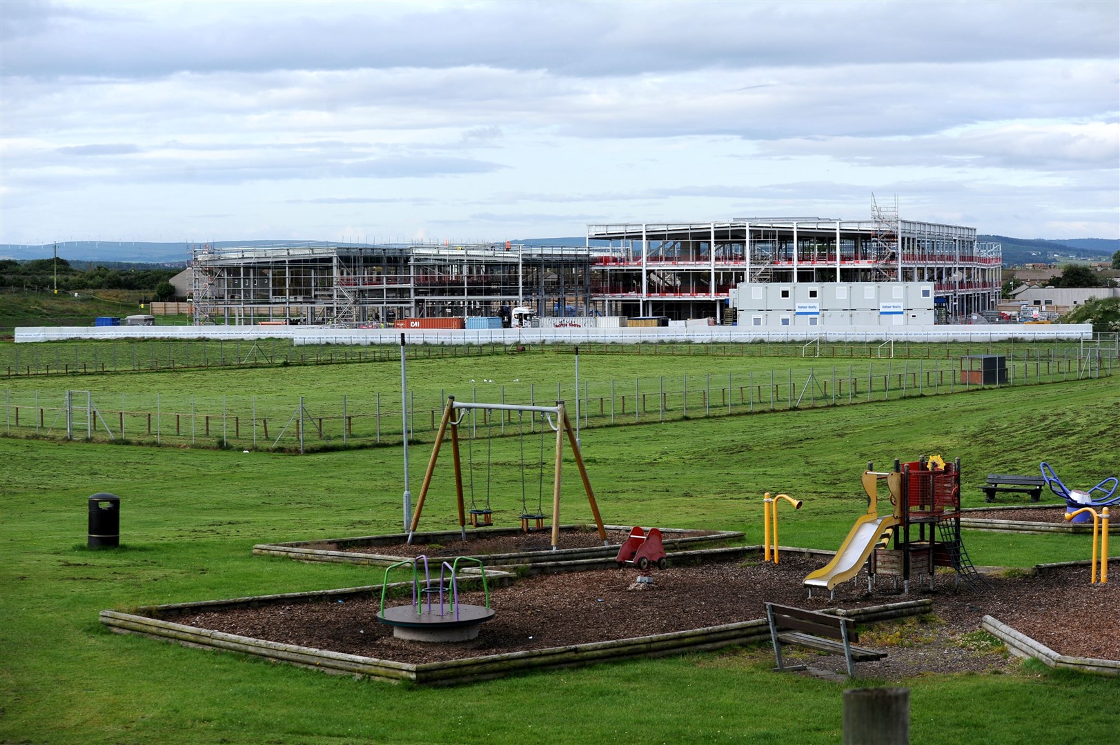 A view across the park and playing fields to the new Lossiemouth High School, which is under construction. Picture: Eric Cormack. Image No. 044459.