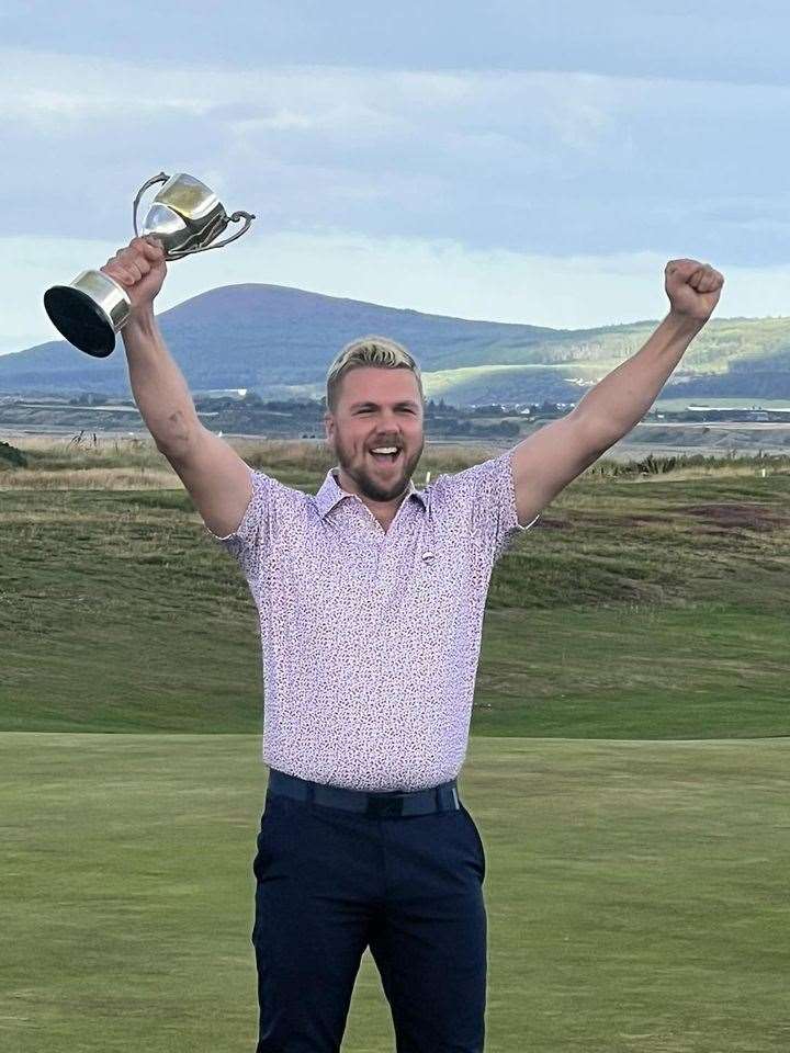 Jonny Neilson celebrates after his triumph in Section 2. Picture: Spey Bay GC