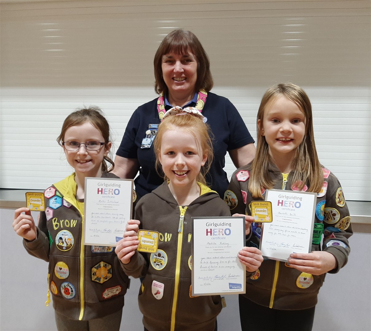 Girlguiding Moray country commissioner Louise Winder with Matilda, Charlotte and Mollie.