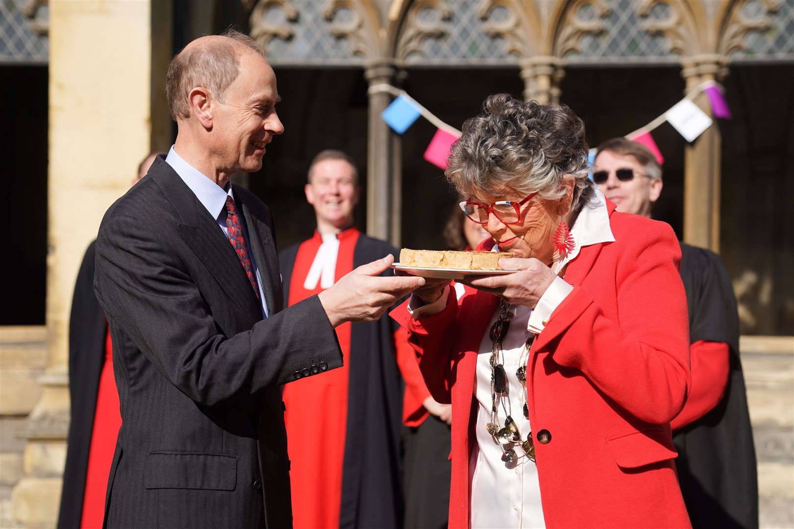 The Duke of Edinburgh watches as Coronation Big Lunch ambassador Dame Prue Leith takes a sniff of the official coronation quiche (James Manning/PA)
