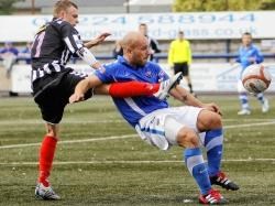 Graeme Beveridge challenges for the ball in Elgin's shock defeat at Montrose.