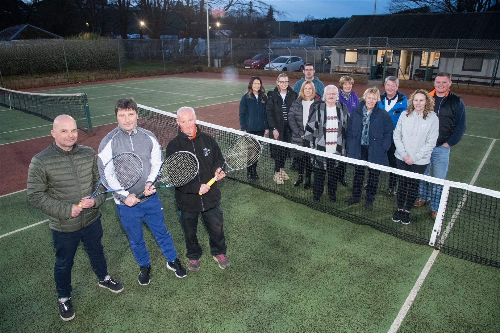 Rothes Tennis club members are joined by benefactors supporting renovation work being carried out. Picture: Daniel Forsyth