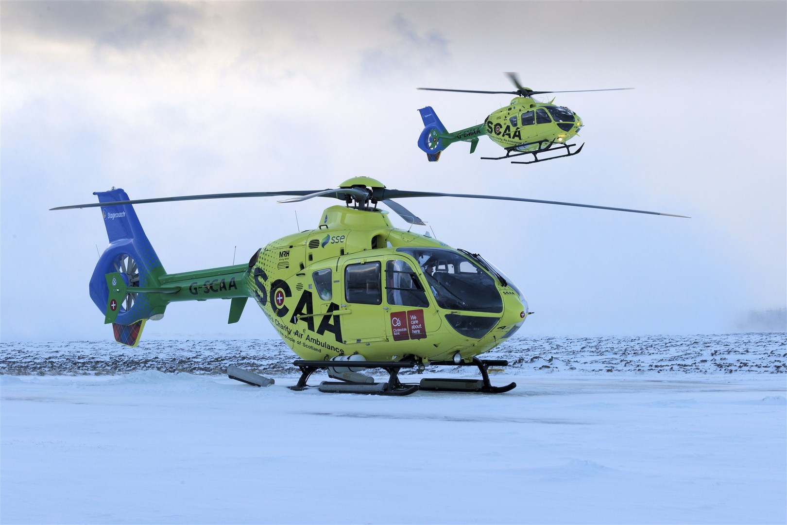 Scotland's Charity Air Ambulance's two helicopters Helimed 76 (G-SCAA) and Helimed 79 (G-EMAA) pictured together at SCAA's base at Perth Airport. Picture by Graeme Hart.