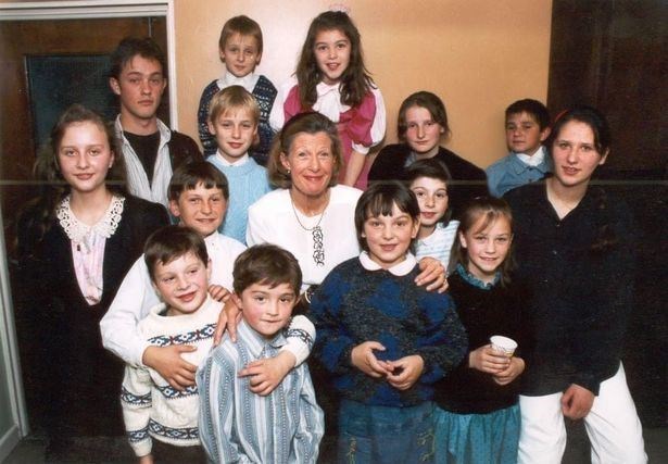 Clare surrounded by the children in 1992.