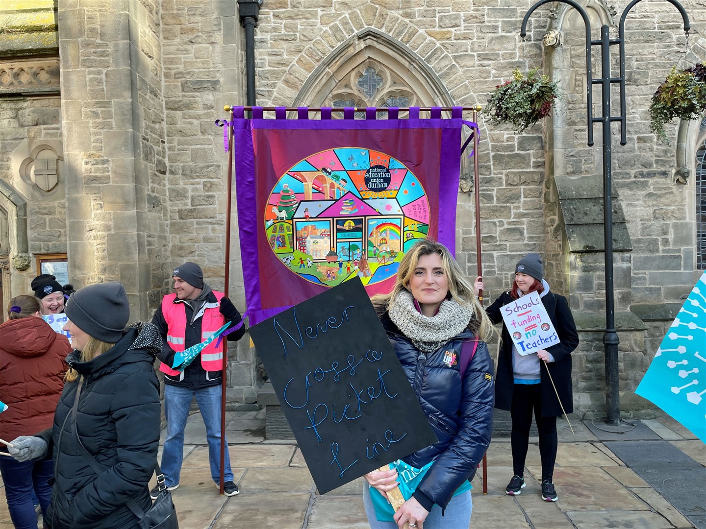 Rochelle Charlton-Laine, a Durham county councillor and art and design technology teacher, joins protesters from the NEU, Trades Union Congress, Public and Commercial Services, and University and College Union outside Durham town hall (Rochelle Charlton-Laine/PA)