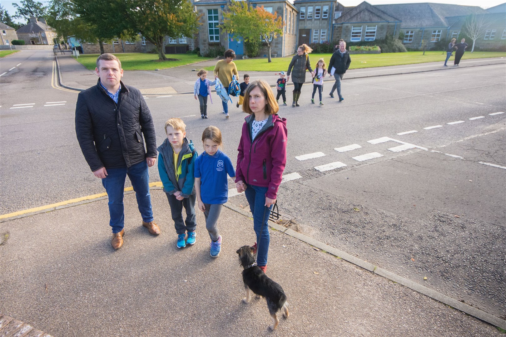 Douglas Ross and Alison Hedley outside Bishopmill Primary School with Leo (8) and Aria (7). Picture: Daniel Forsyth..