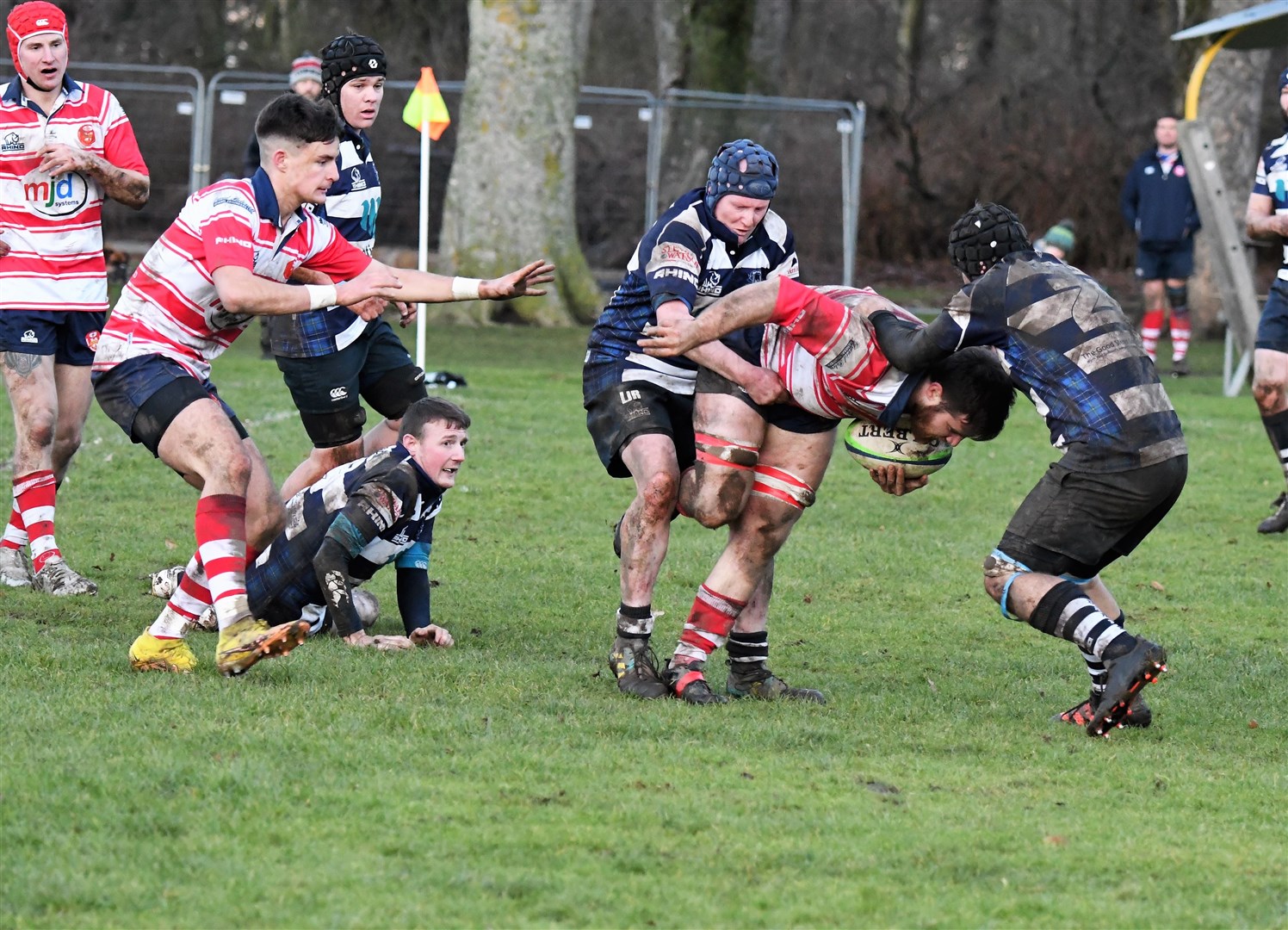 Neil Alexander keeps driving through tackle. Connor Cameron and Rory Millar arriving. Picture by James Officer
