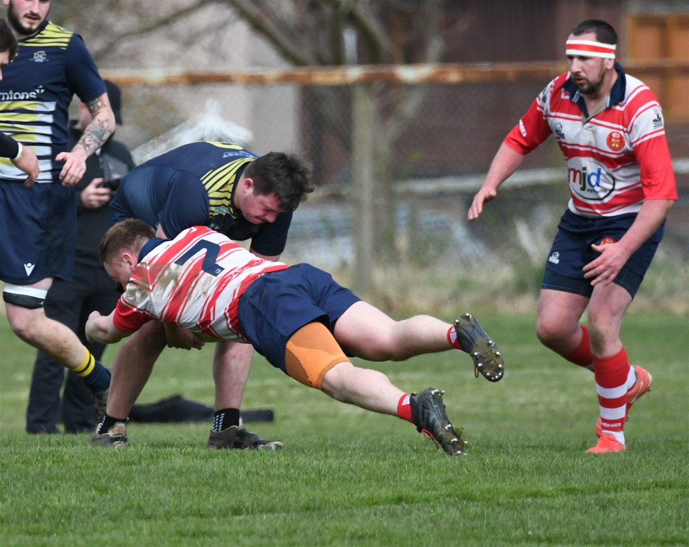 Kris Morrison tackles the Dundee hooker supported by John Westmacott. Picture: James Officer