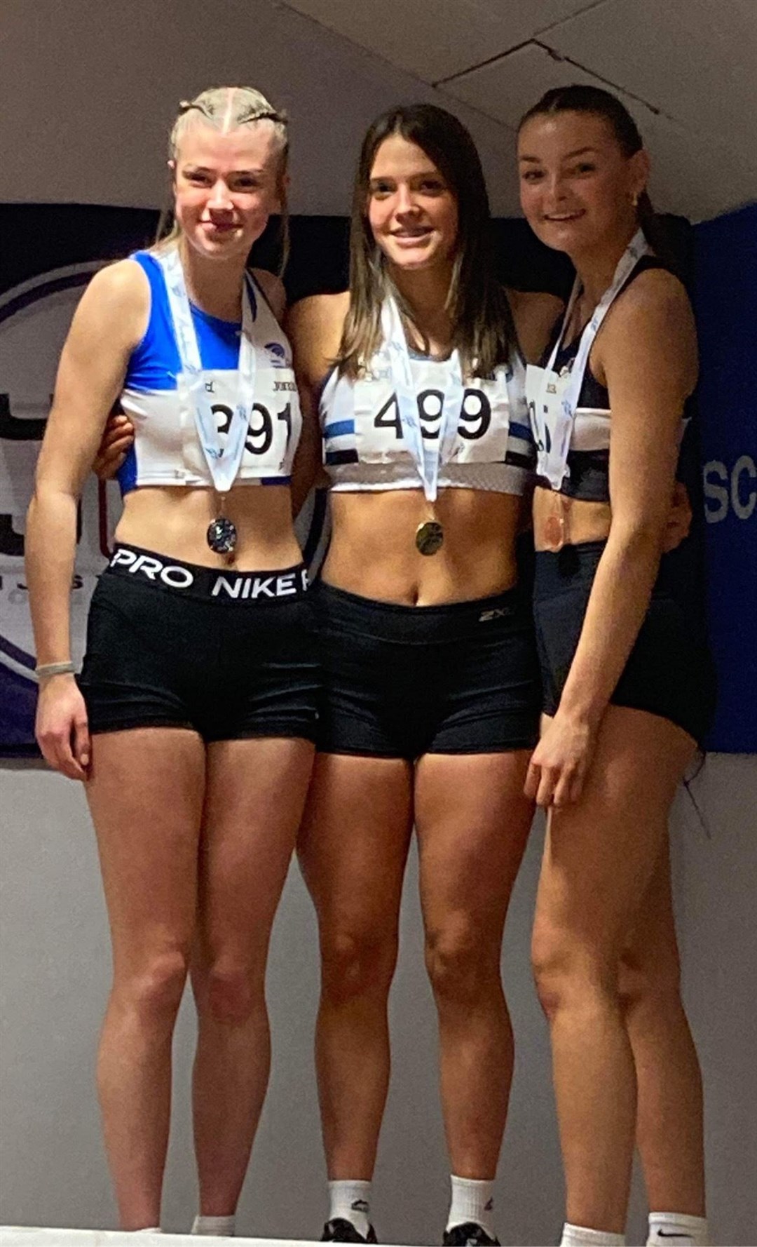 Lexi Grant (right) won bronze in the national triple jump.