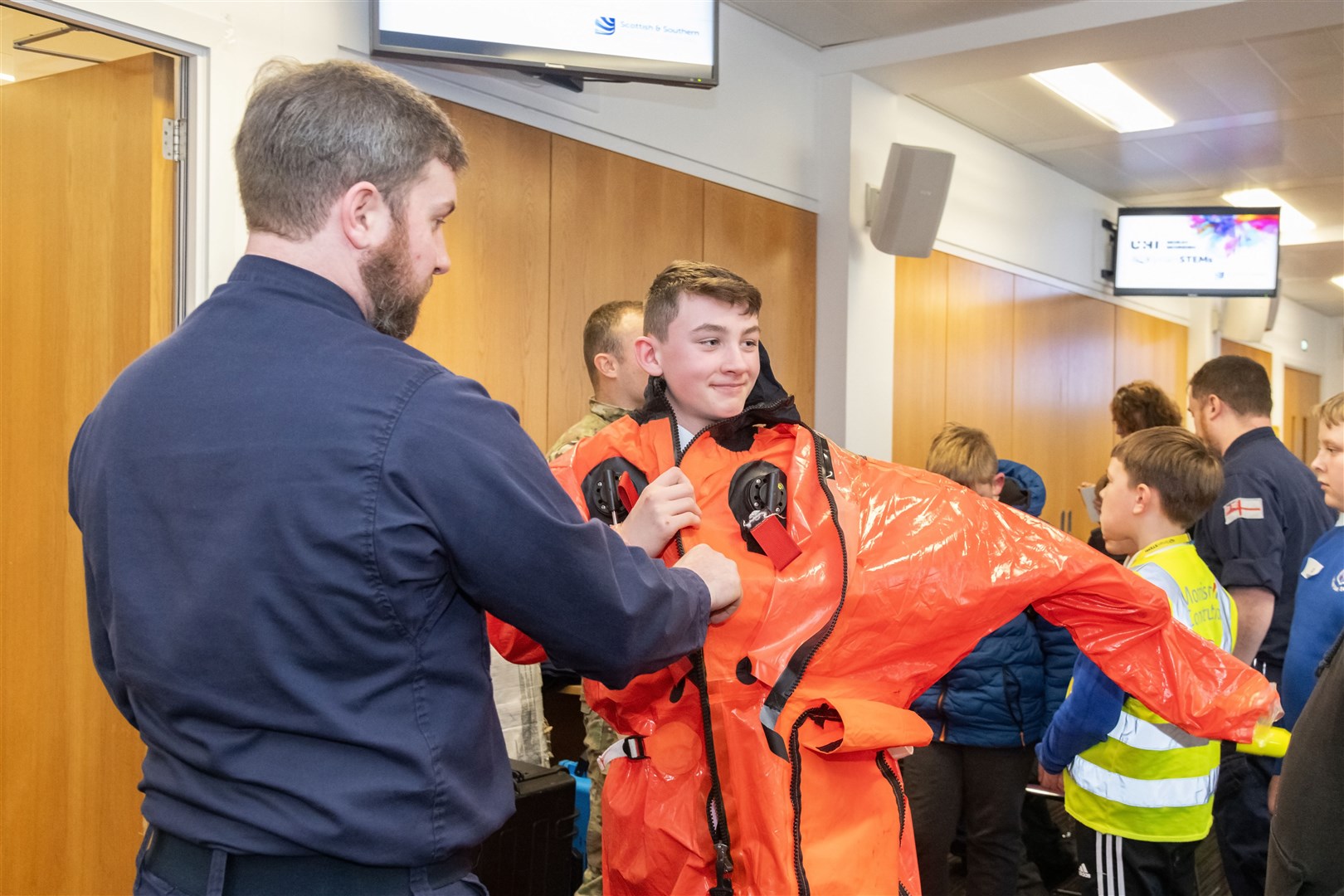 Pupils enjoyed trying out the Navy's submarine survival kit. Picture: Beth Taylor