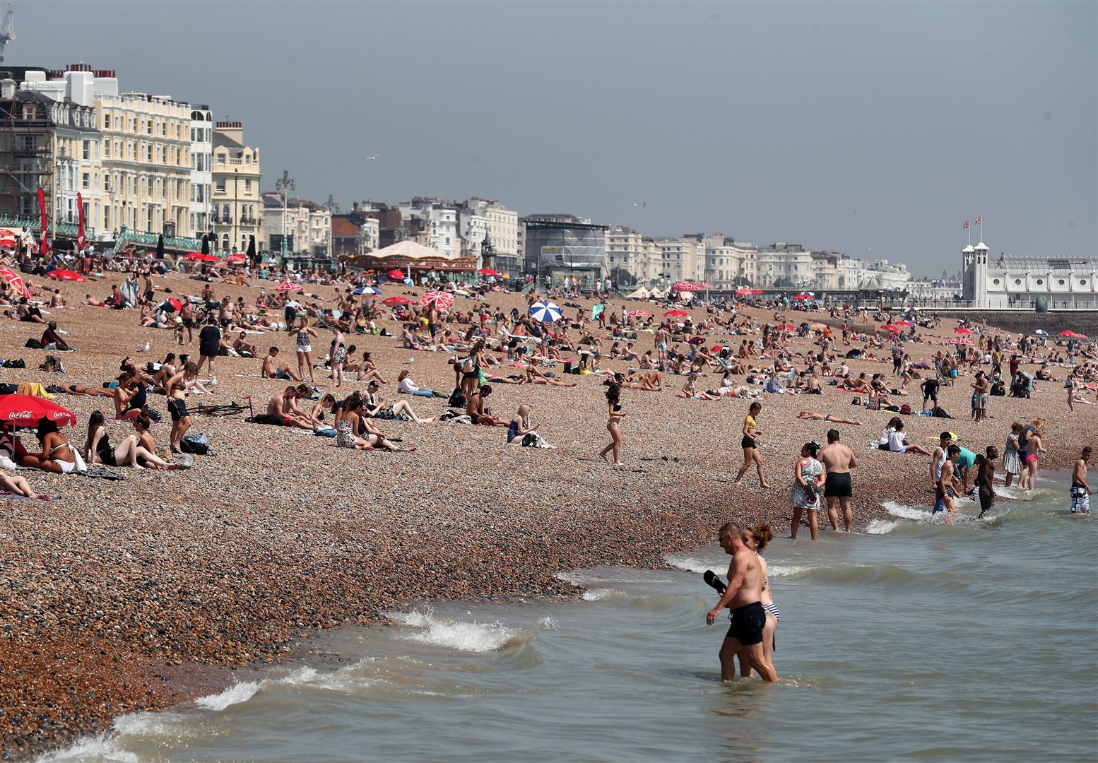 People will be heading to the beach as temperatures rise this week (PA)