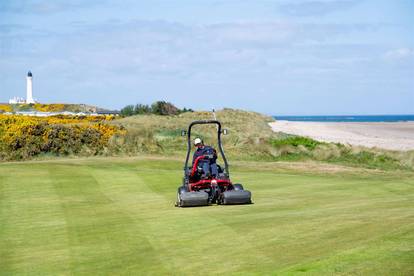 Ryan Sherwood drives up the fairway as preparations continue at Moray Golf Club. Picture: Daniel Forsyth.