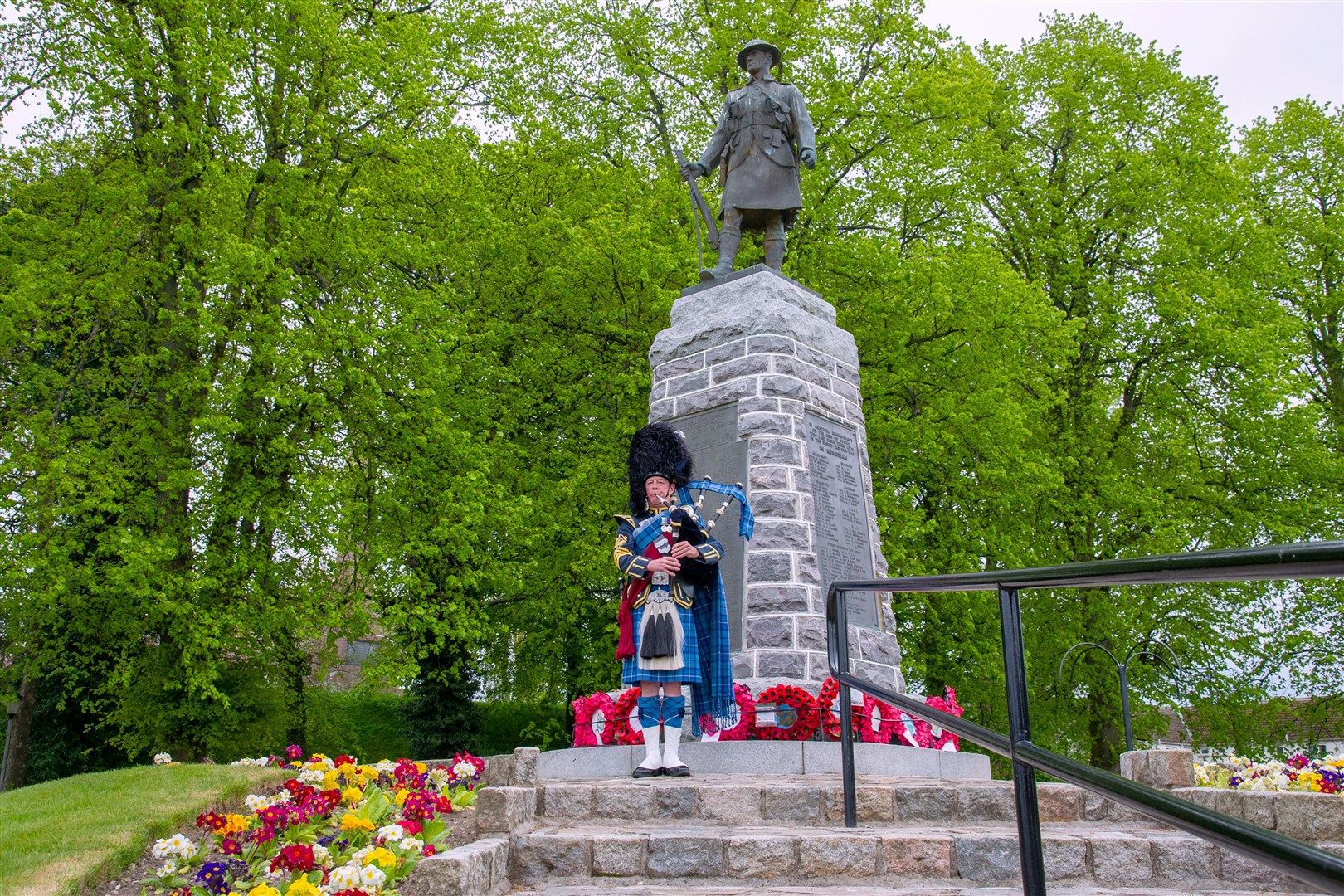 Pipe Major Barry Ashby plays in remembrance at the Forres War Memorial. Barry is the Pipe Major of the RAF Lossiemouth Pipe Band and also tends to the war memorial gardening as part of the Forres in Bloom team...75th anniversary celebrations of VE Day at the Forres War Memorial...Picture: Daniel Forsyth..