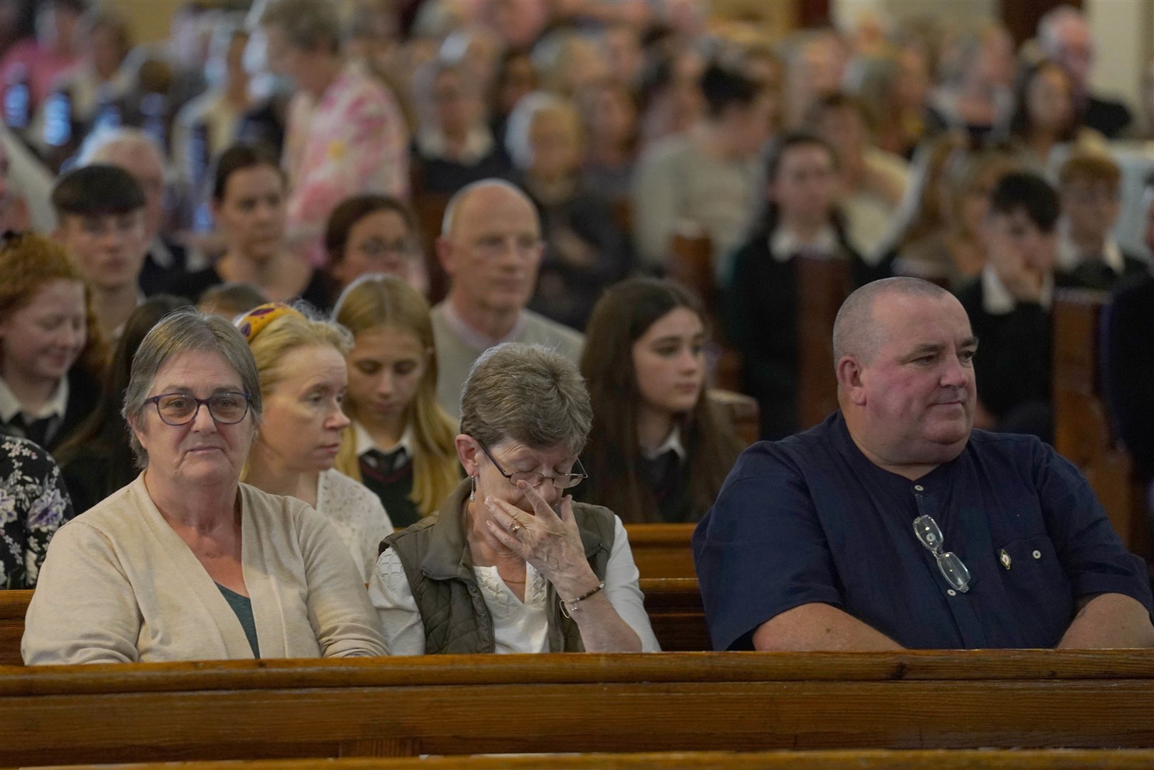 People attend a vigil at St John the Baptist Church in Cashel (Brian Lawless/PA)