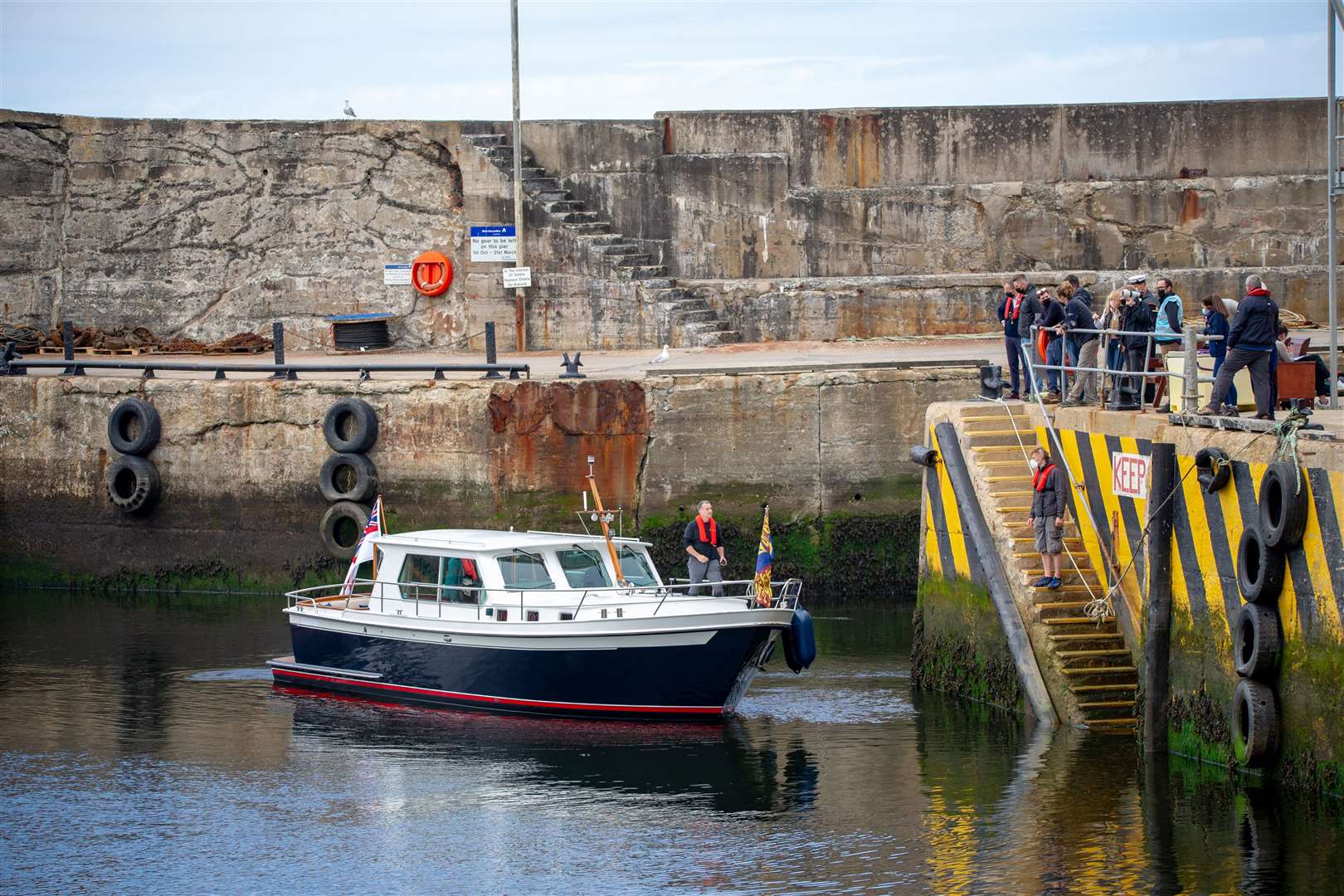 A boat arrives at Macduff Harbour as part of filming for Netflix hit The Crown. Picture: Daniel Forsyth.