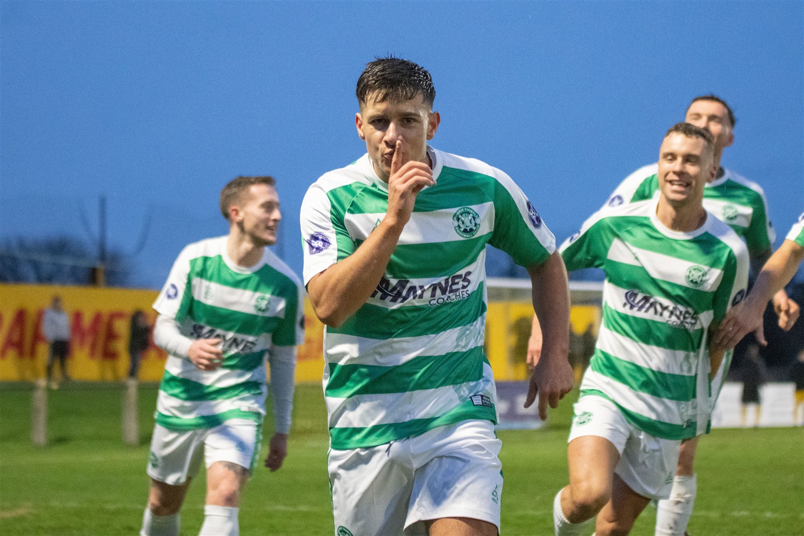 A Shhhhhh from Buckie Thistle's Max Barry after scoring in the first half...Forres Mechanics FC (1) vs Buckie Thistle FC (8) - Highland Football League 23/24 - Mosset Park, Forres 30/12/2023...Picture: Daniel Forsyth..