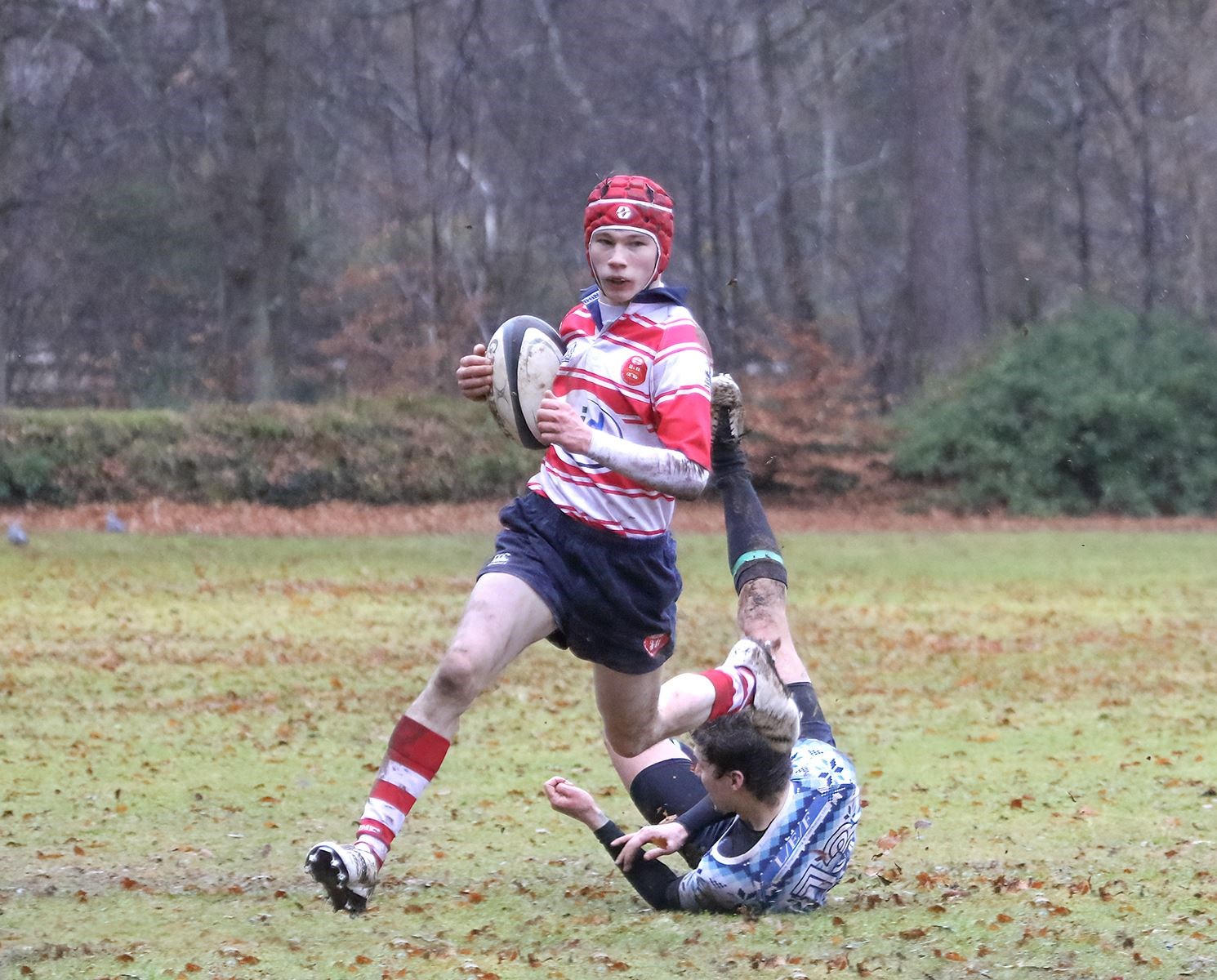 Lewis Hay gets outside a defender on his way to scoring a try. Photo: John MacGregor