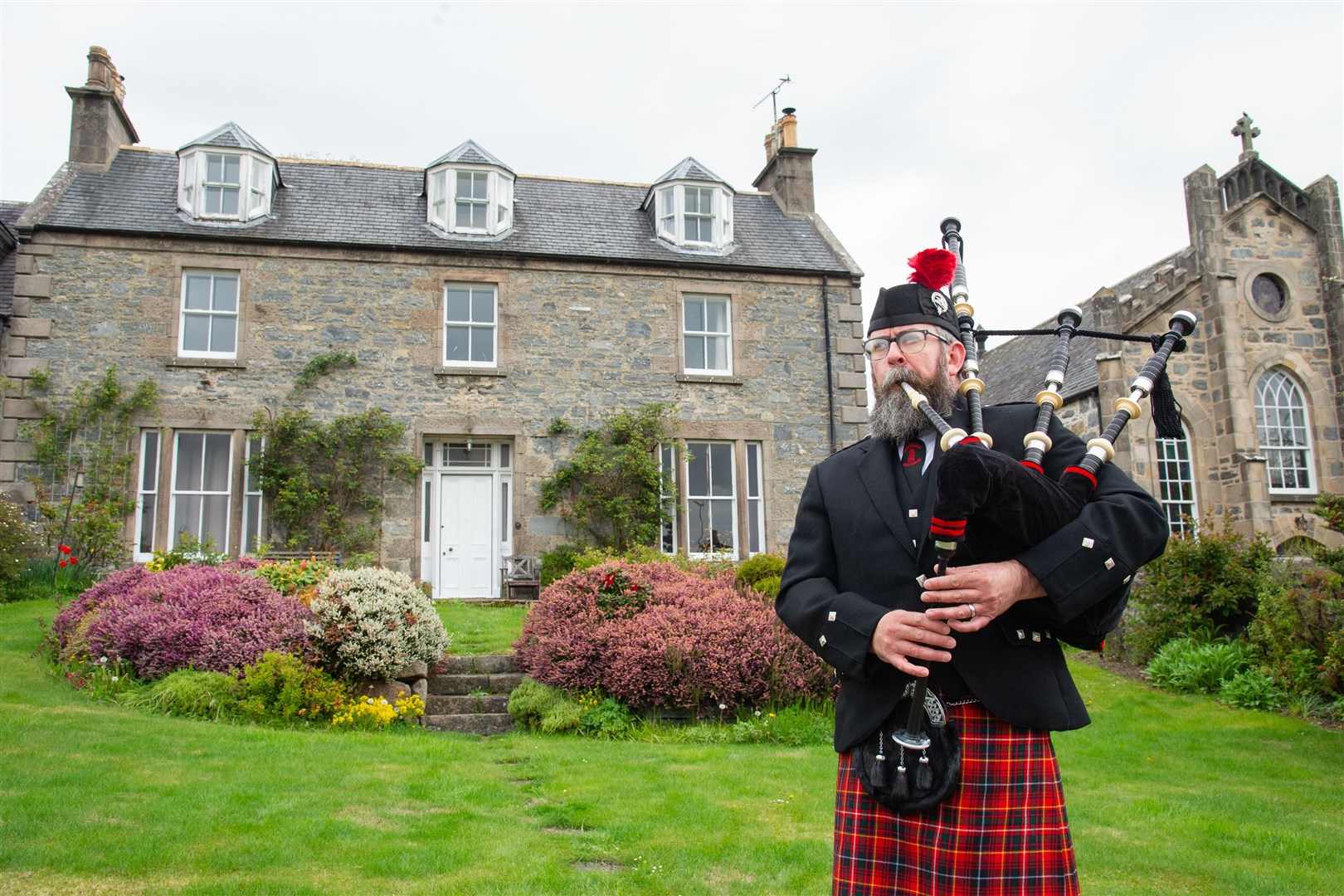 Dufftown and District Pipe Band member Chris Jameson takes a minute to remember during the VE Day 75th anniversary celebrates. All pictures by Daniel Forsyth.
