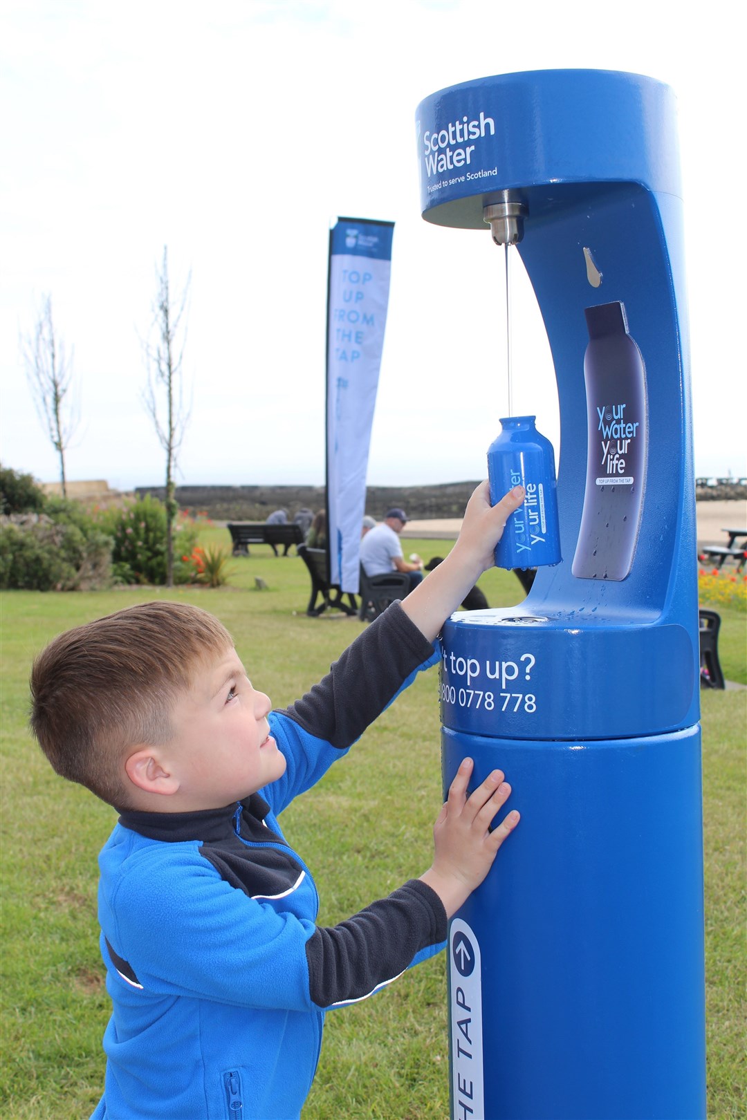 Rico Thompson (6) gets Lossiemouth’s new Top Up Tap flowing.
